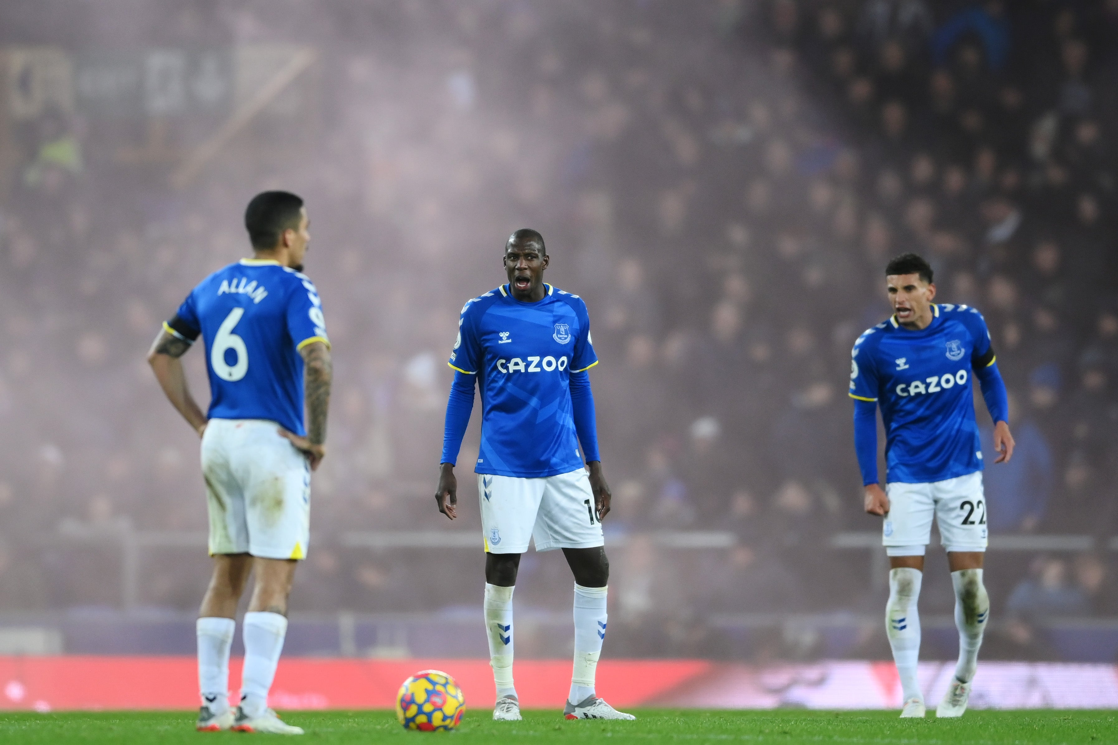 Everton’s Abdoulaye Doucoure and Ben Godfrey exchange words with Allan after Liverpool’s fourth goal