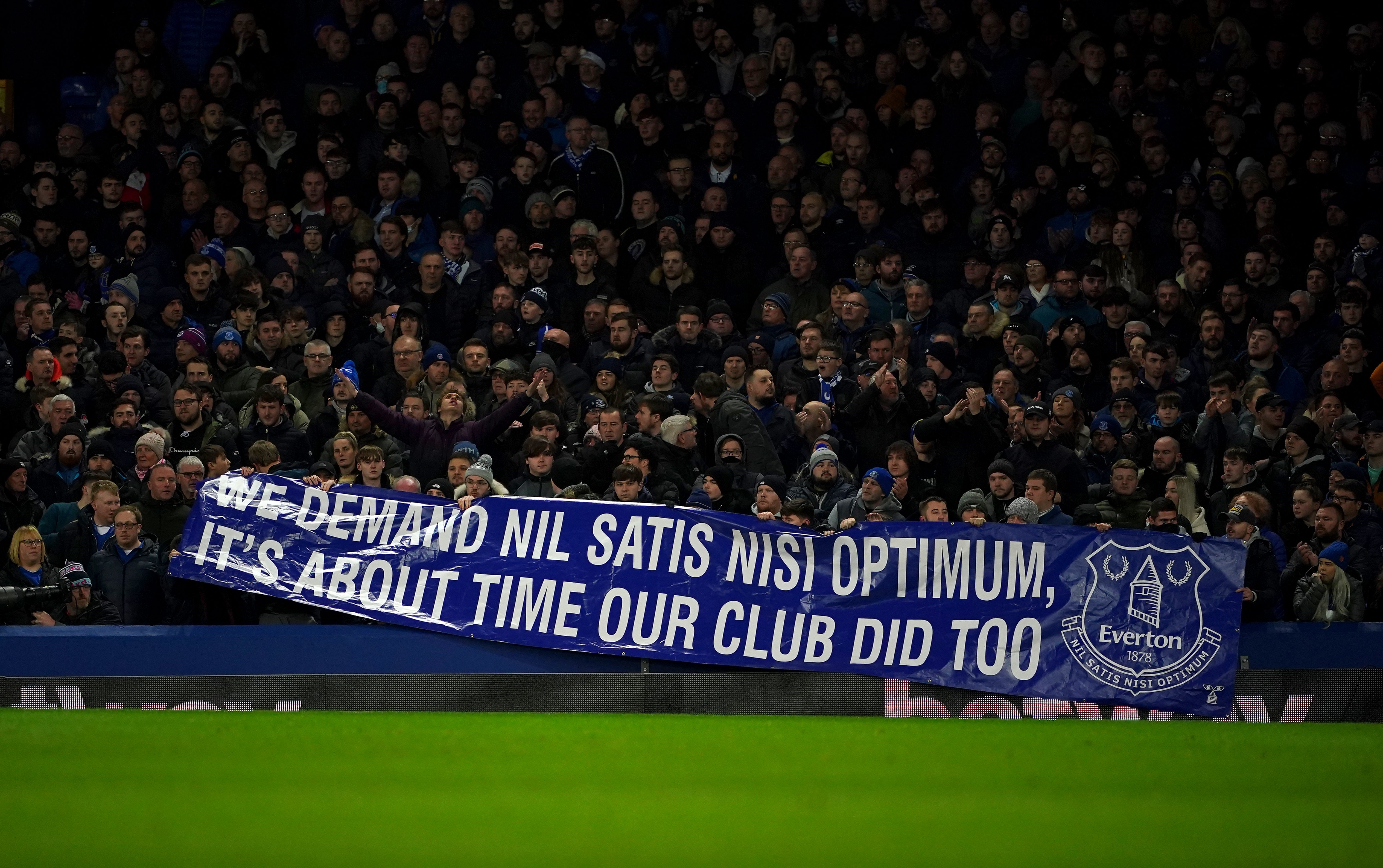 A banner displayed by Everton fans referring to the club’s motto ‘Nil Satis Nisi Optimum’, which translates as ‘nothing but the best is good enough’ (Peter Byrne/PA)