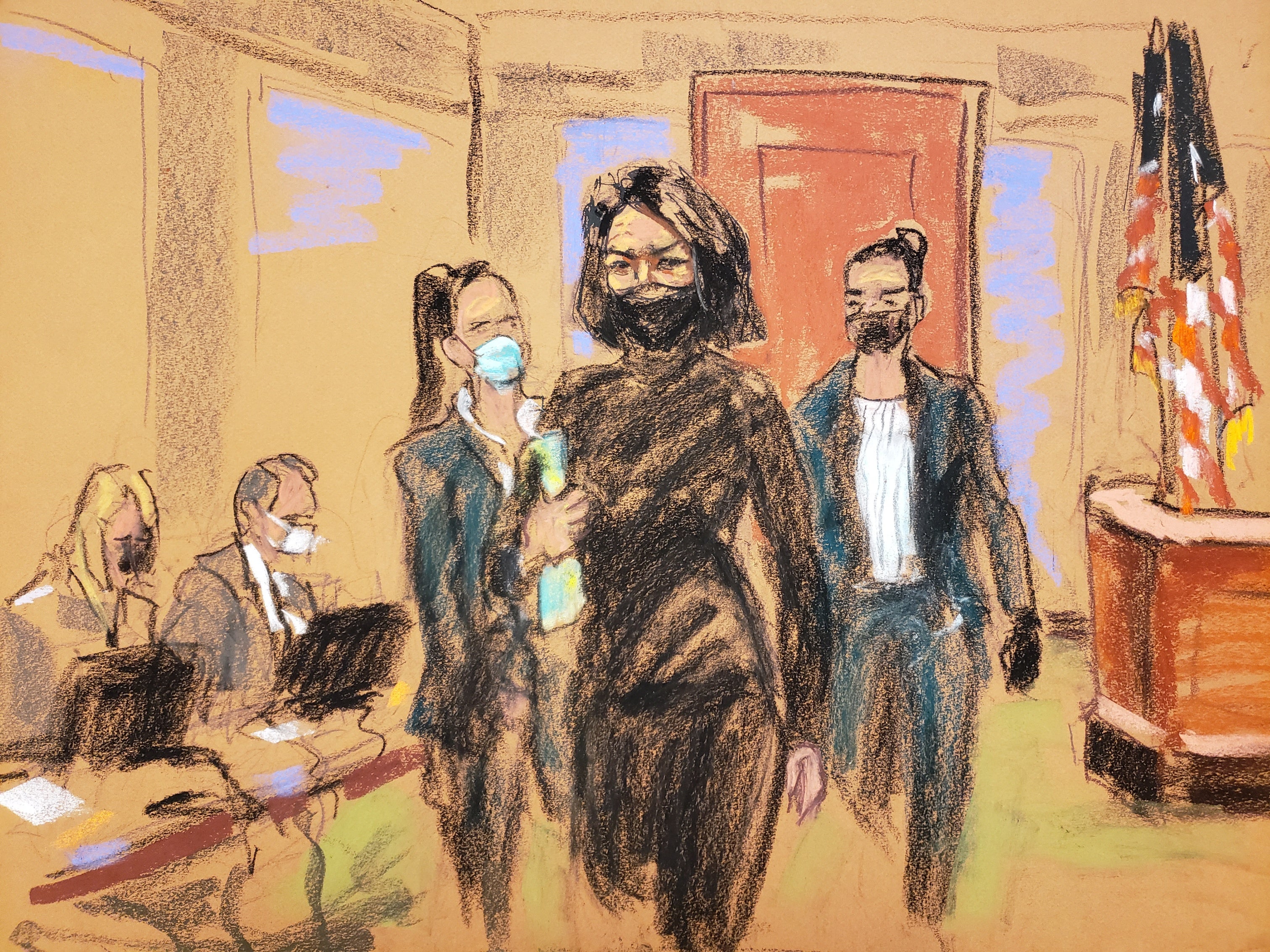 Ghislaine Maxwell enters court flanked by two US marshalls for day four of her trial on charges of sex trafficking, in New York City, on Thursday