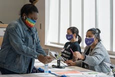 Georgia election workers targeted by Trump supporters over his ‘big lie’ sue conspiracy website