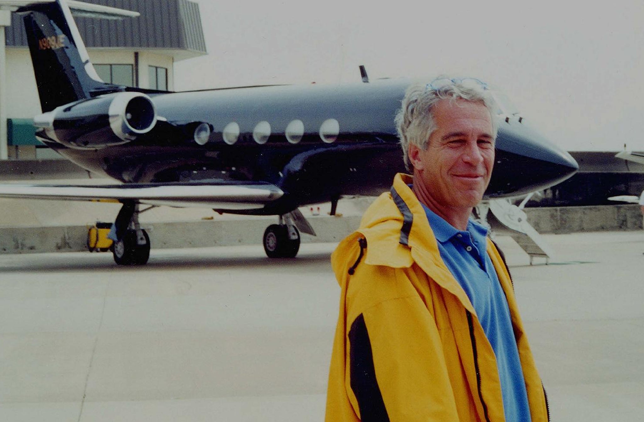 Epstein in front of one of his private jets