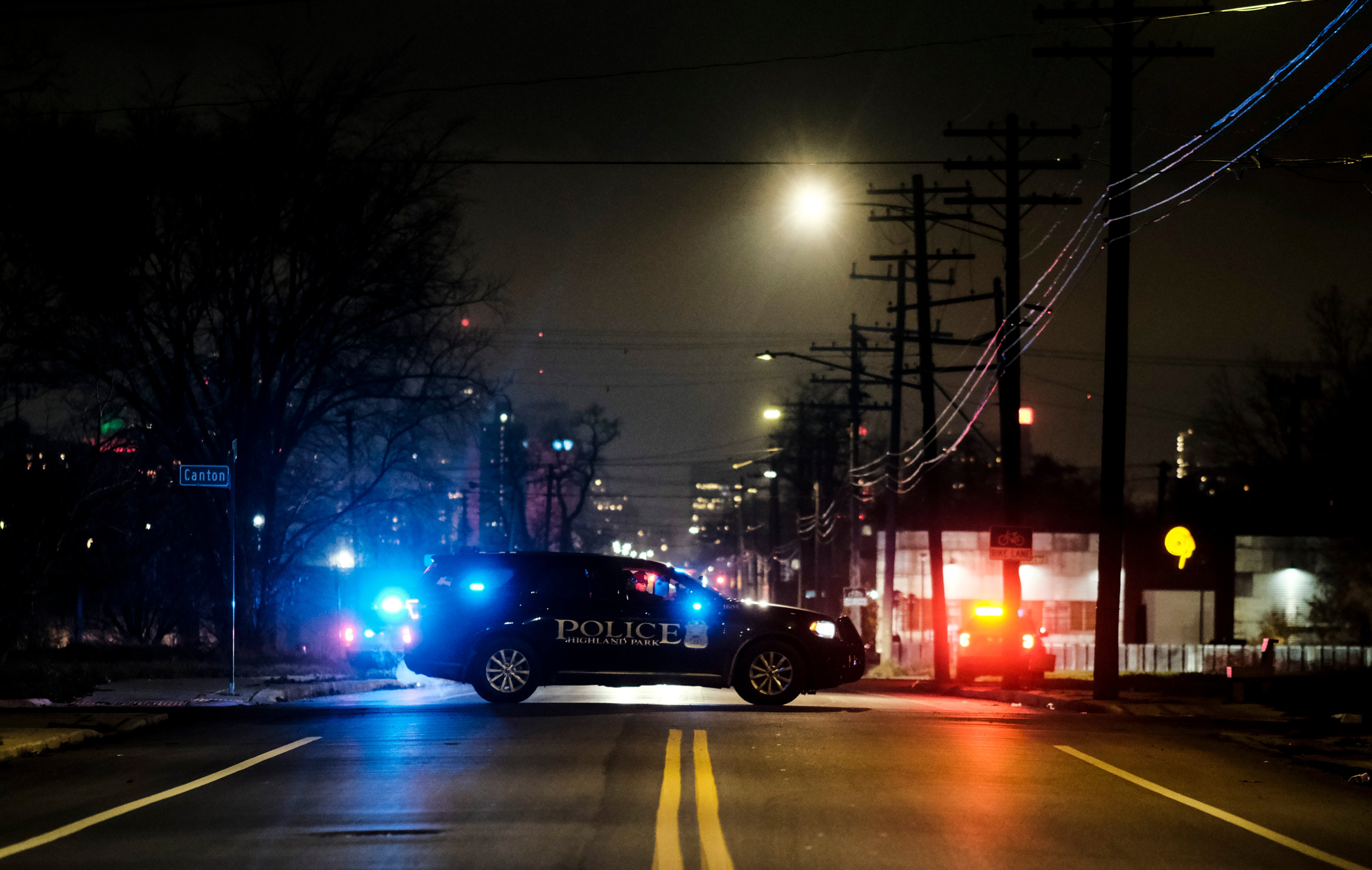 Law enforcement are seen surrounding the building in Detroit where the Crumbleys were found