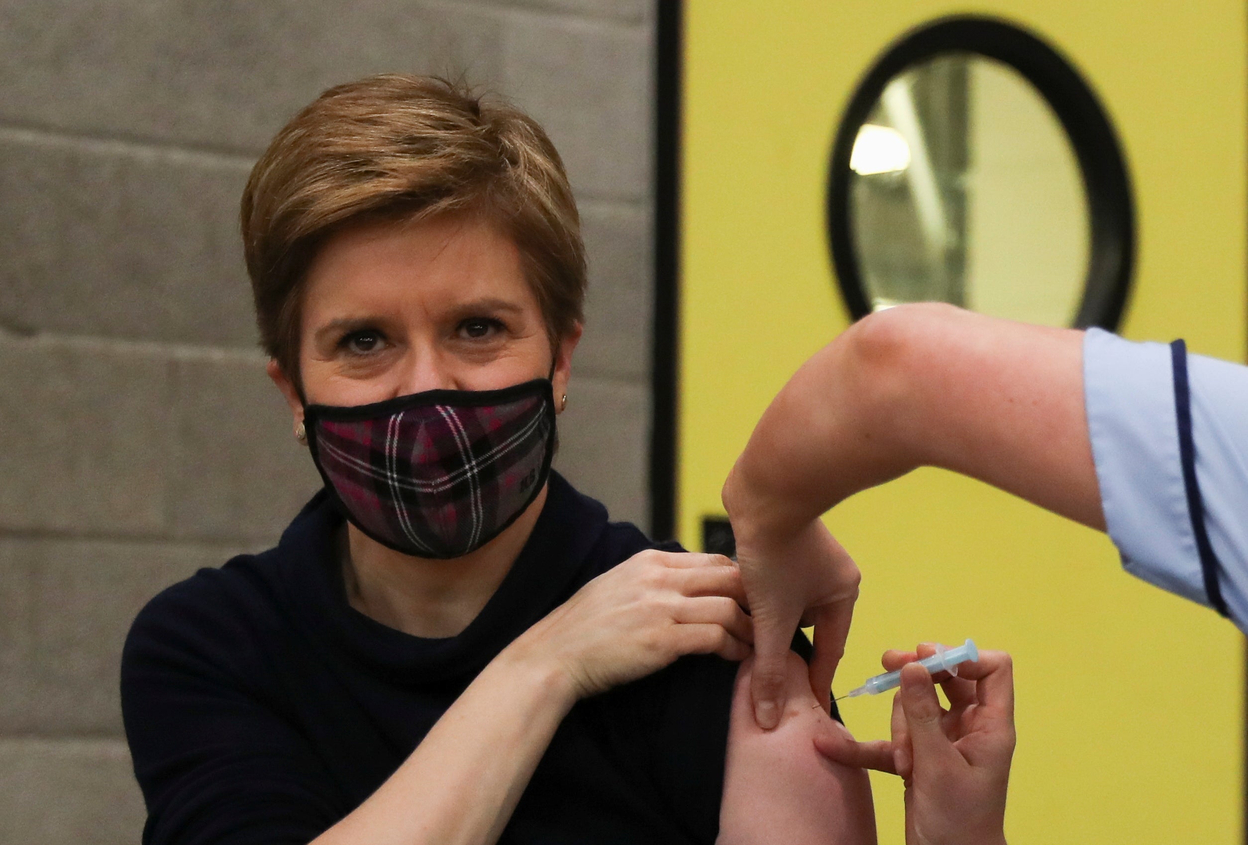 First Minister of Scotland Nicola Sturgeon receives her booster jab of the coronavirus vaccine in Glasgow (Russell Cheyne/PA)