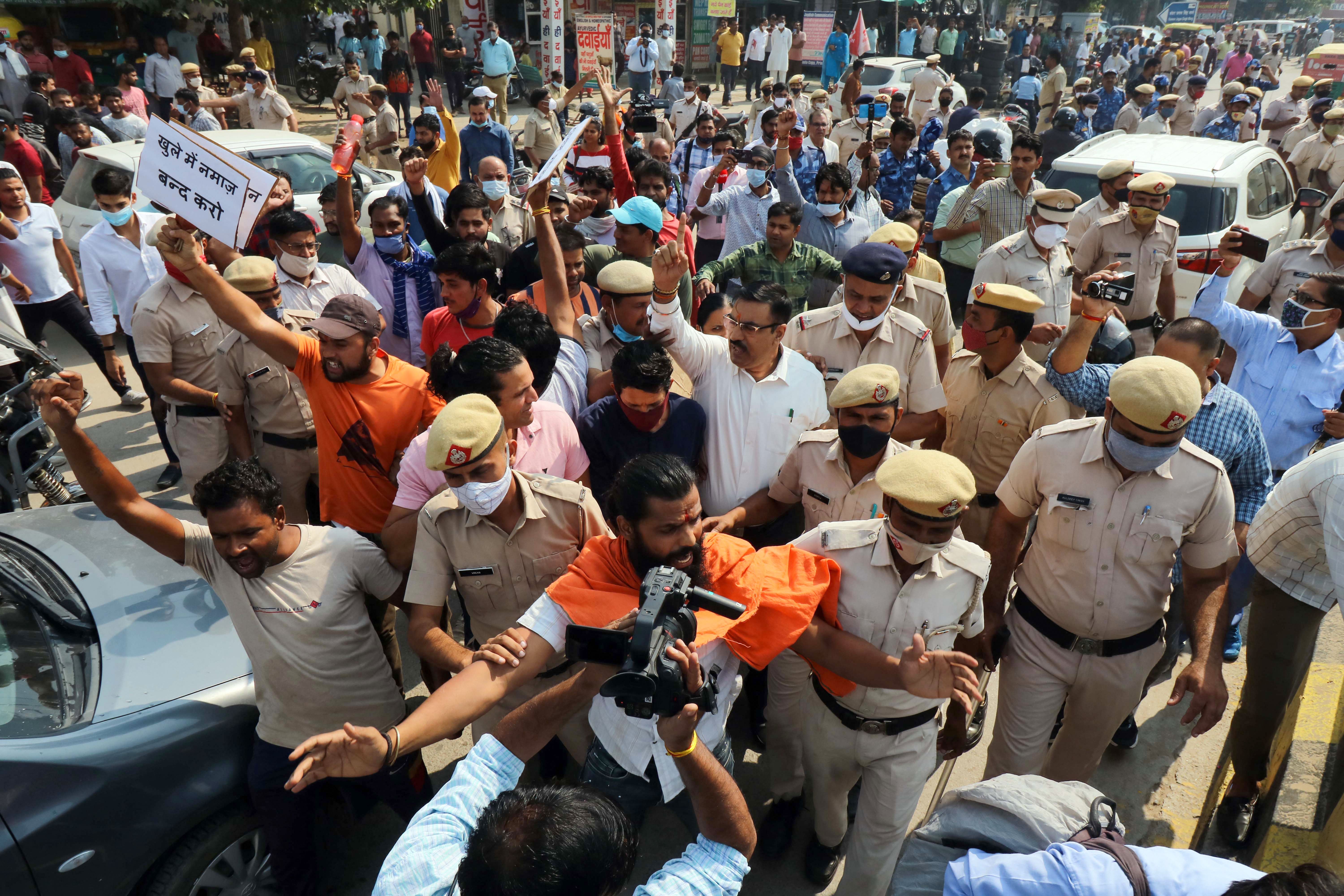 Police stand guard to secure the site of Friday prayers amid protests by Hindu right-wing groups in Gurugram in October