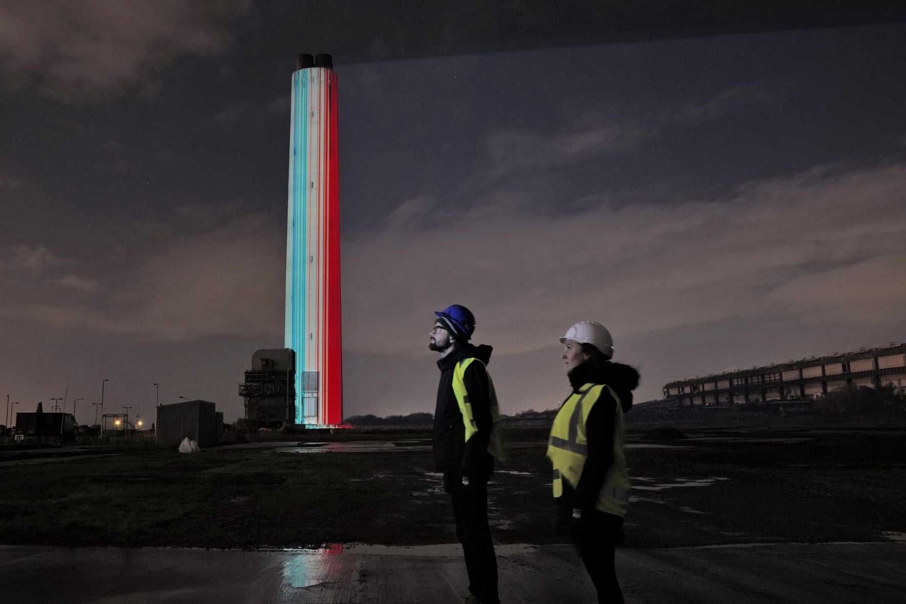 The Global Warming Stripes projected on the chimney(Stuart Atwood/PA)