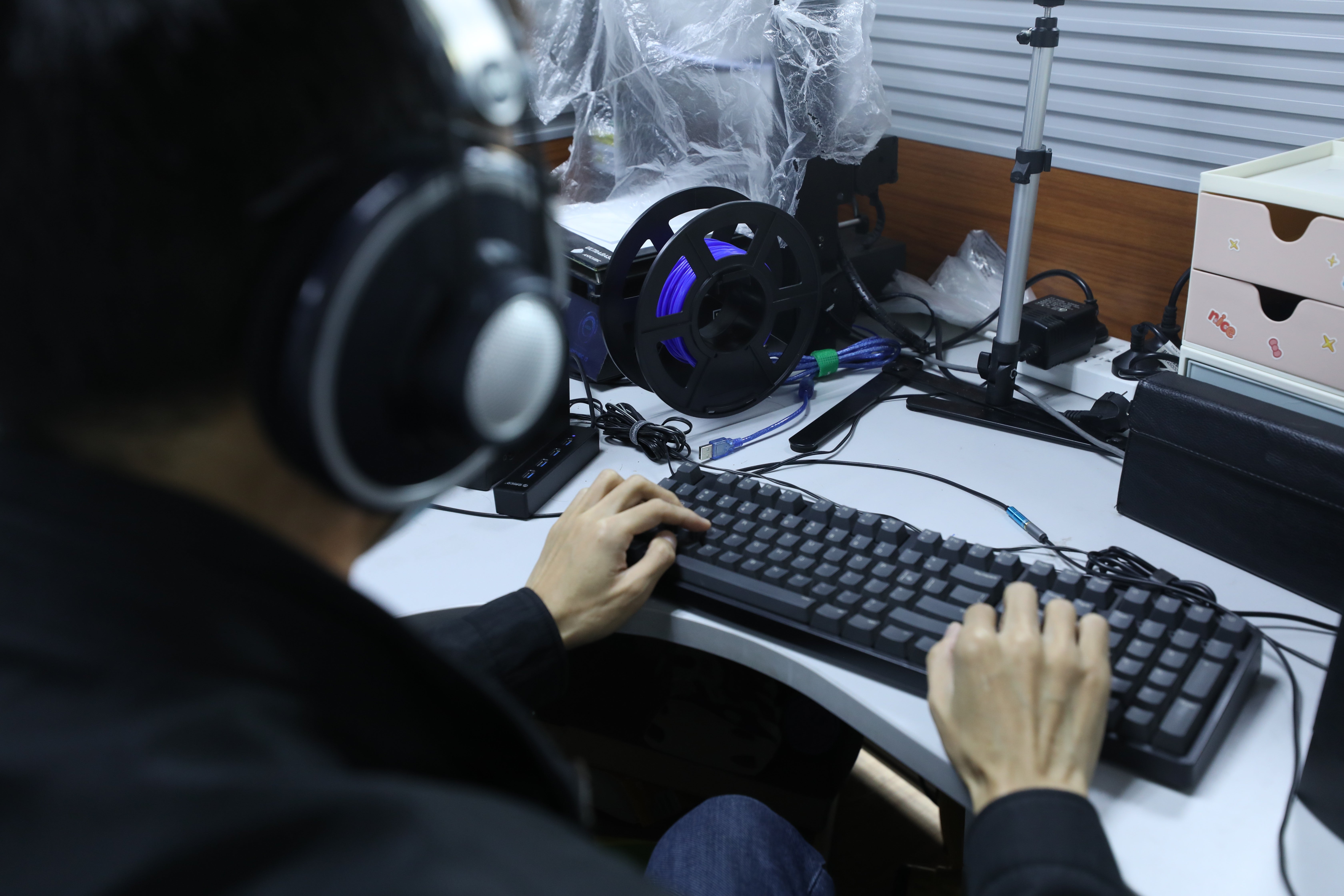 Zhang Junjun, a member of a team developing software to help visually impaired people read at the Braille Library of China, codes using a computer and a screen-reading programme