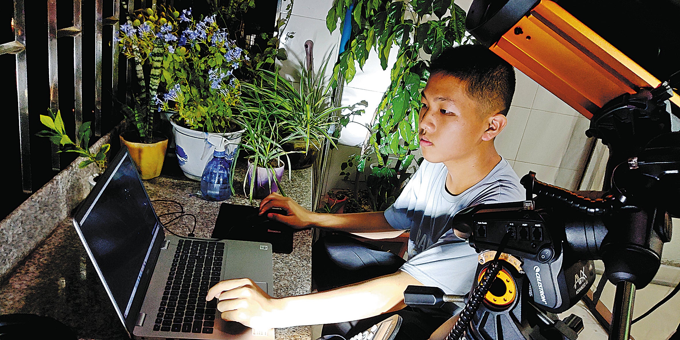 Wang takes photos from the balcony of his home in Yongtai county, Fujian province