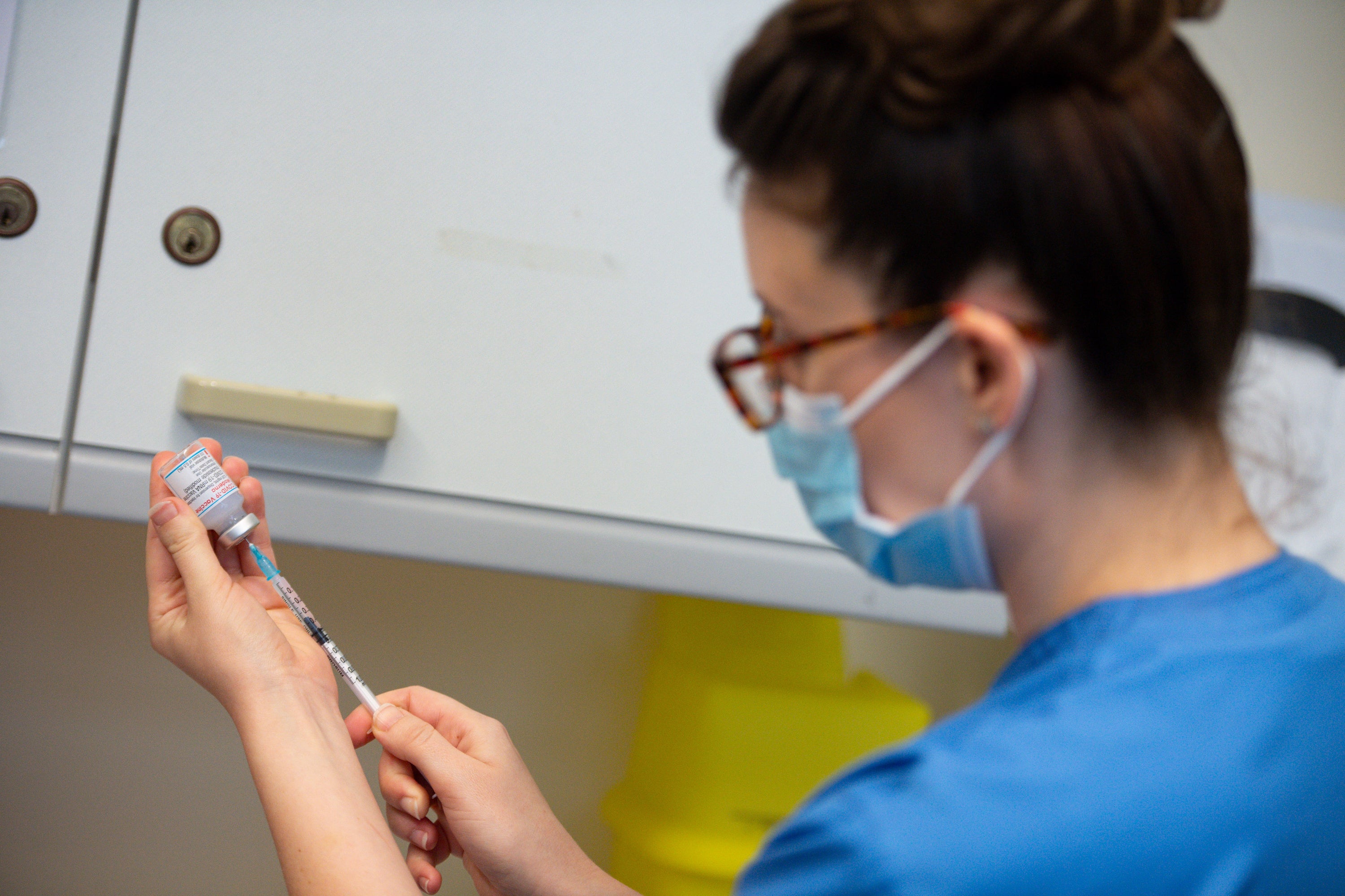 A nurse prepares the Moderna Covid-19 vaccine at the West Wales General Hospital in Carmarthen (Jacob King/PA)