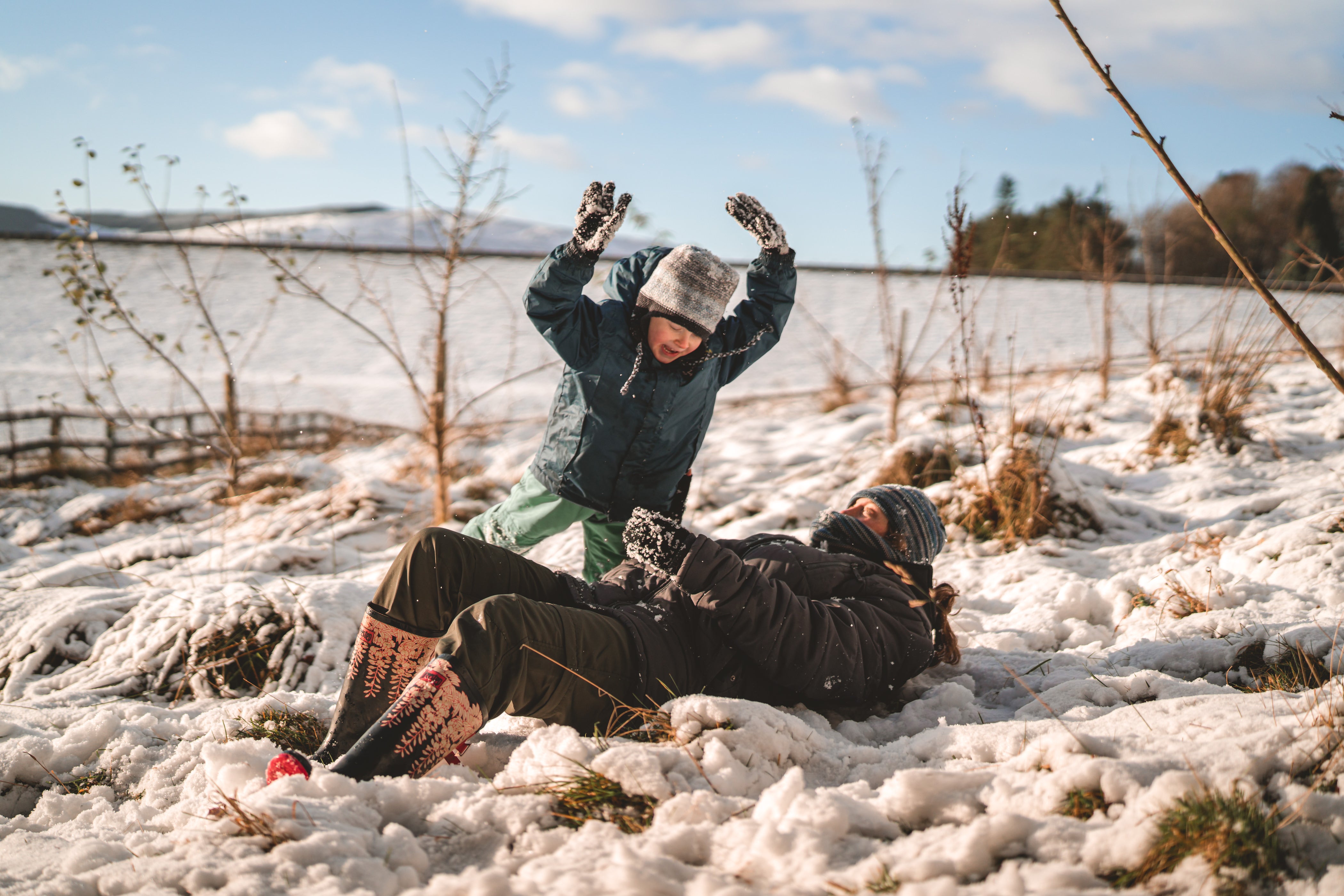 Arthur and John Shahabeddin playing in the snow (John Shahabeddin/PA)