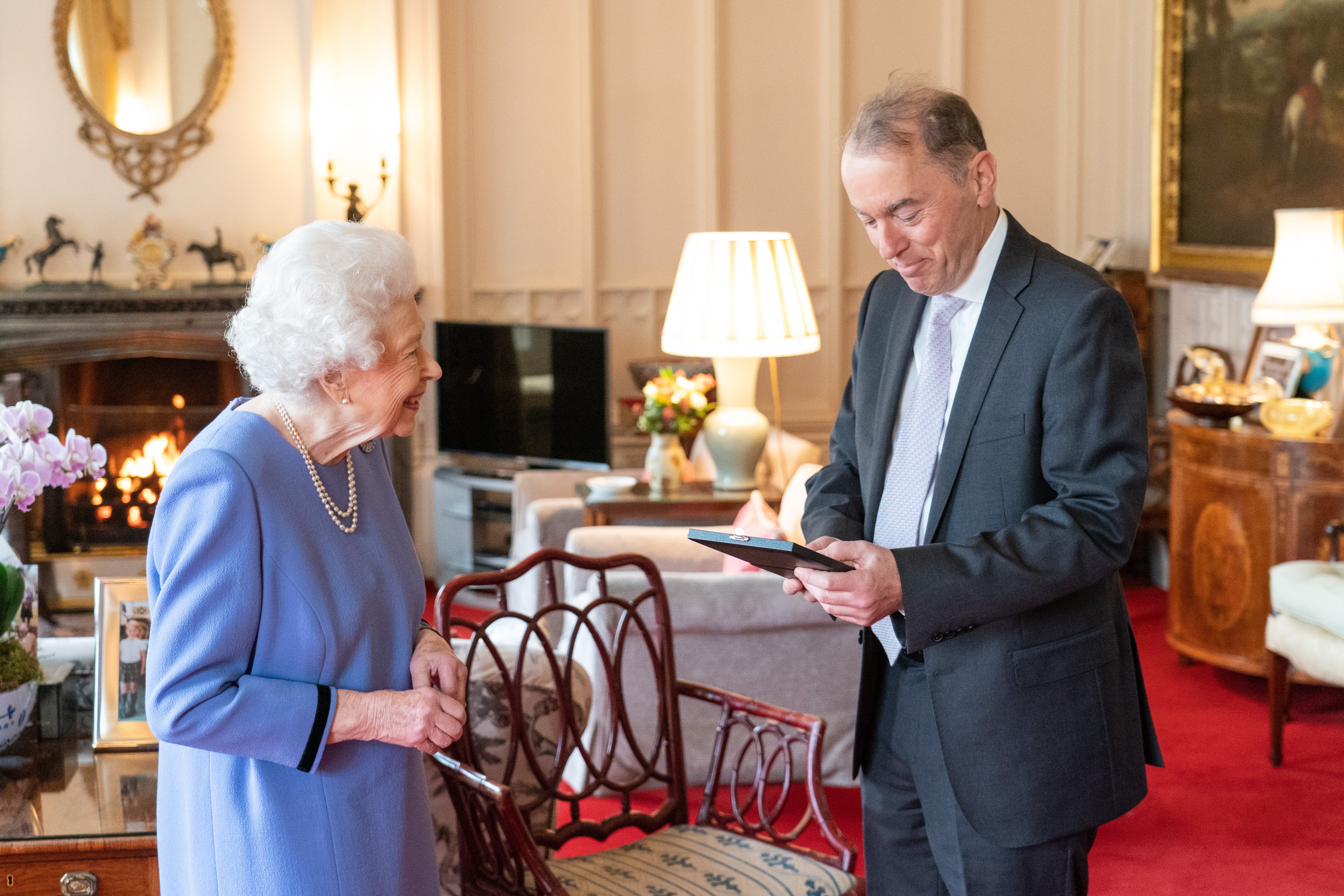 The Queen presents Thomas Trotter with the Queen’s Medal for Music at an audience at Windsor Castle (Dominic Lipinski/PA)