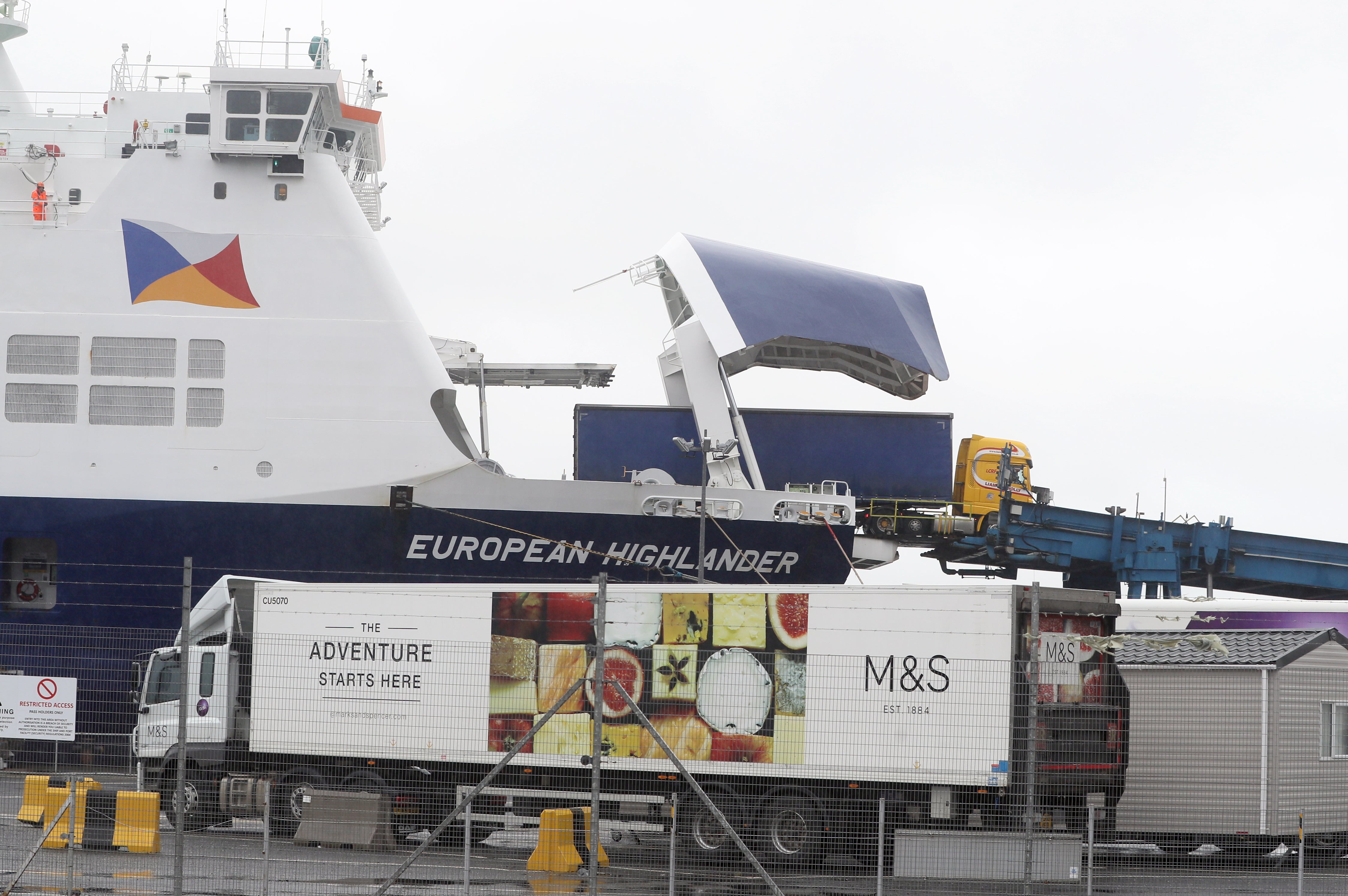 Trucks leaving a ferry at Larne Port in Co Antrim, Northern Ireland (Brian Lawless/PA)