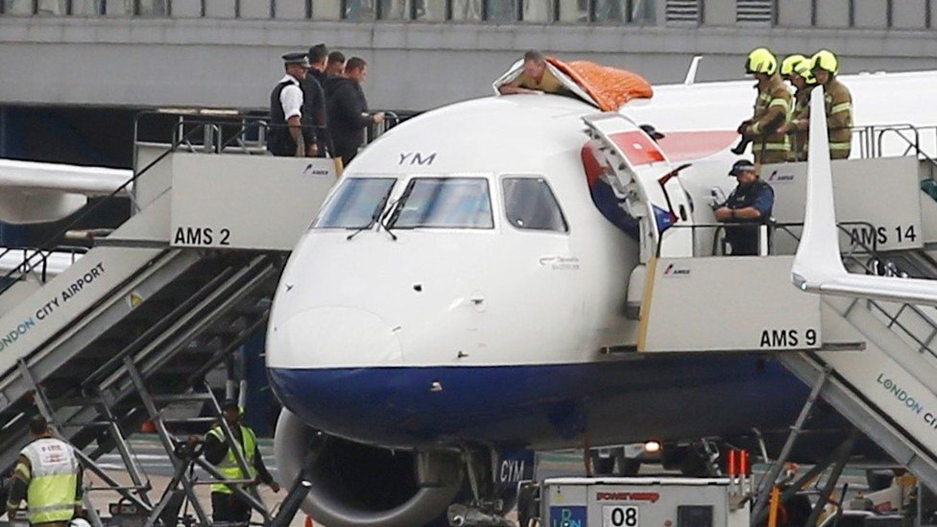 Extinction Rebellion activist James Brown on top of a plane on October 10 2019 during a protest at London City Airport (Extinction Rebellion)