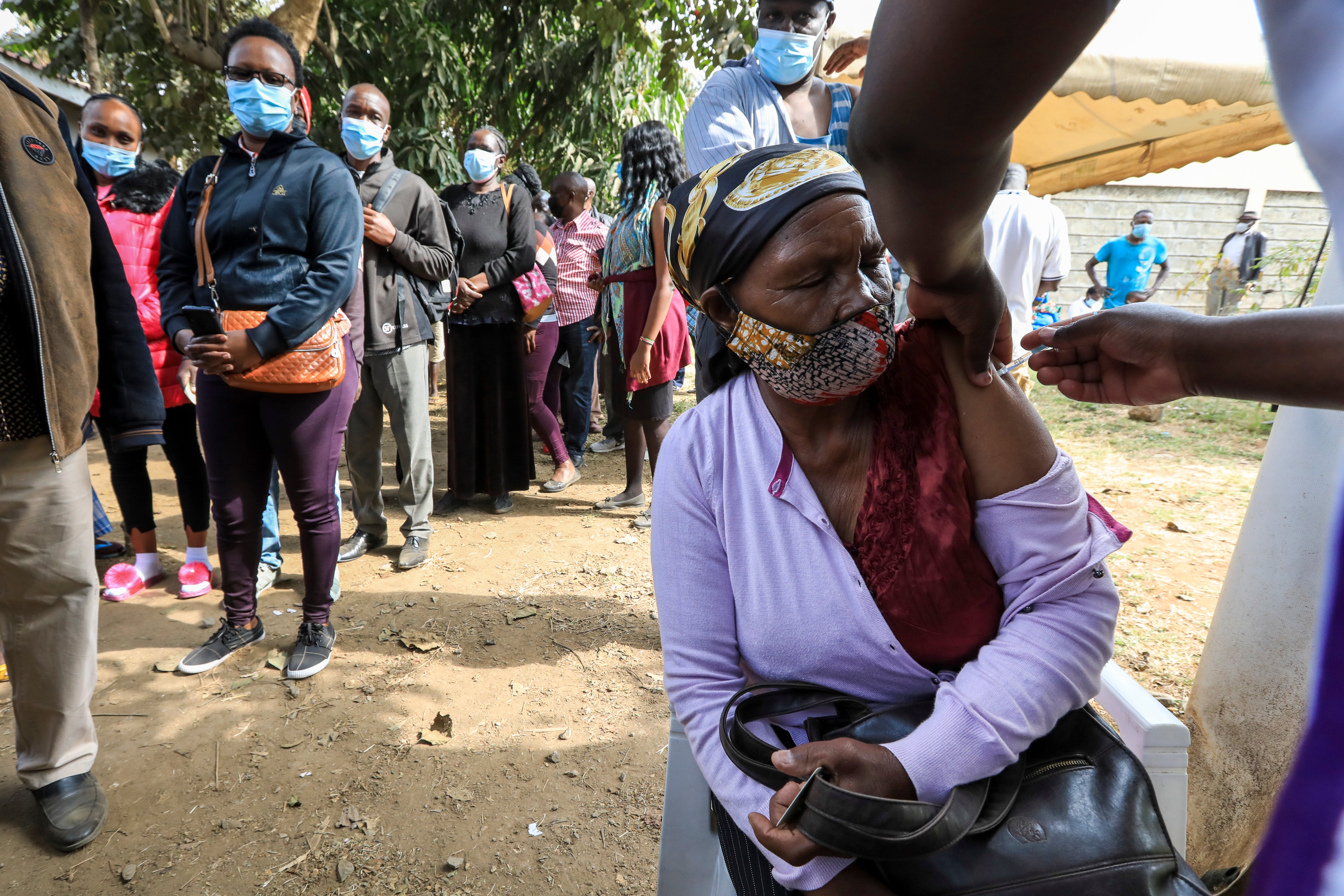 A Kenyan woman is vaccinated in Dandora, a suburb of Nairobi