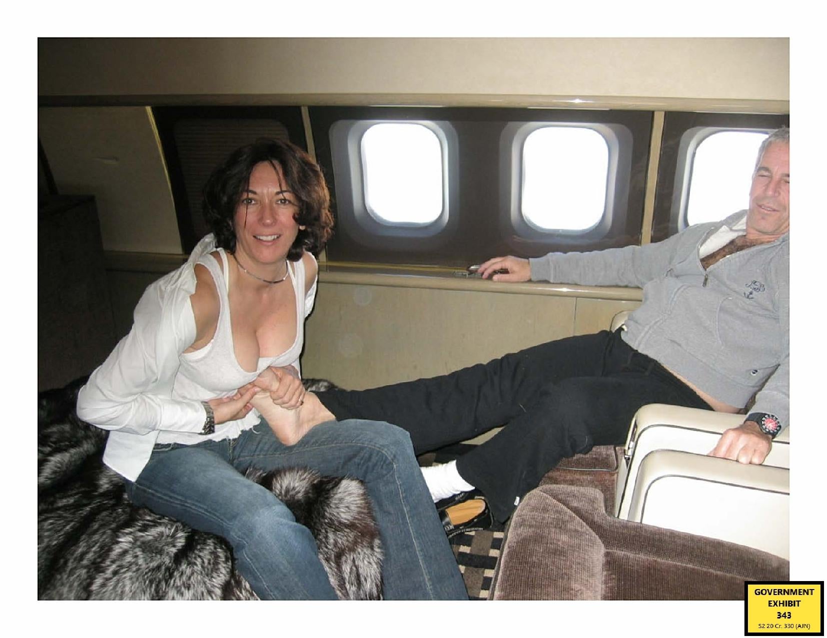 A photo released by prosecutors shows Ghislaine Maxwell giving Jeffrey Epstein a foot massage aboard a private jet