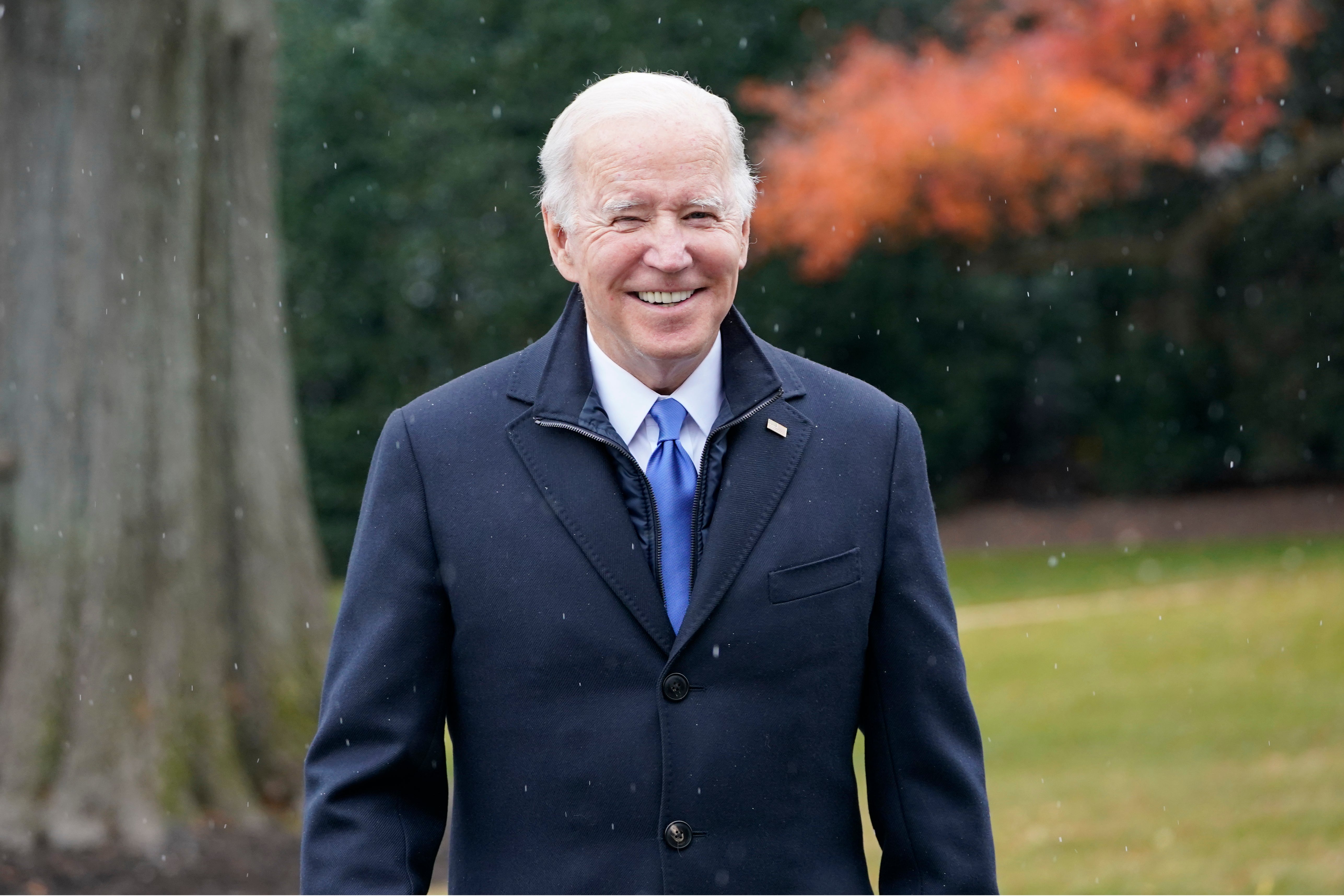 President Joe Biden talks with reporters at the White House in Washington