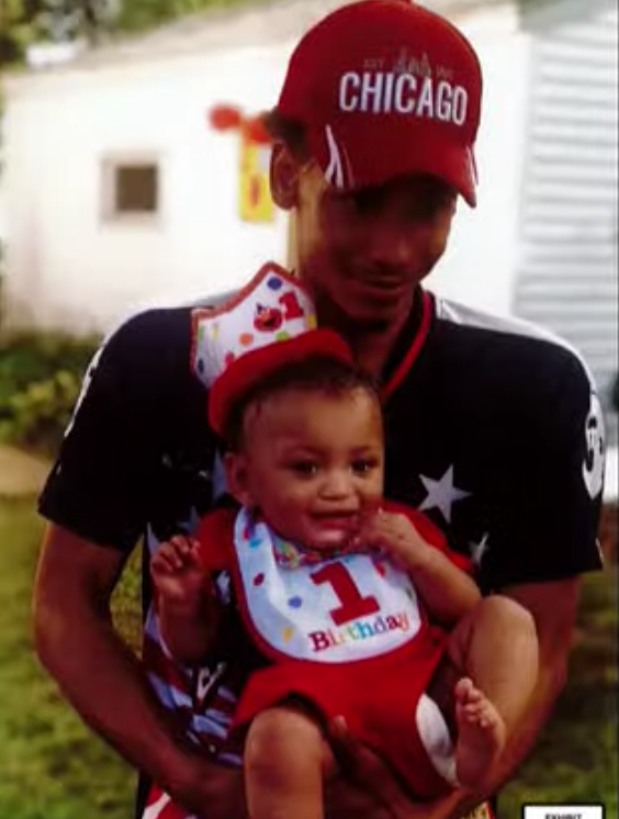 Daunte Wright with his young son in a photo shown to the jury