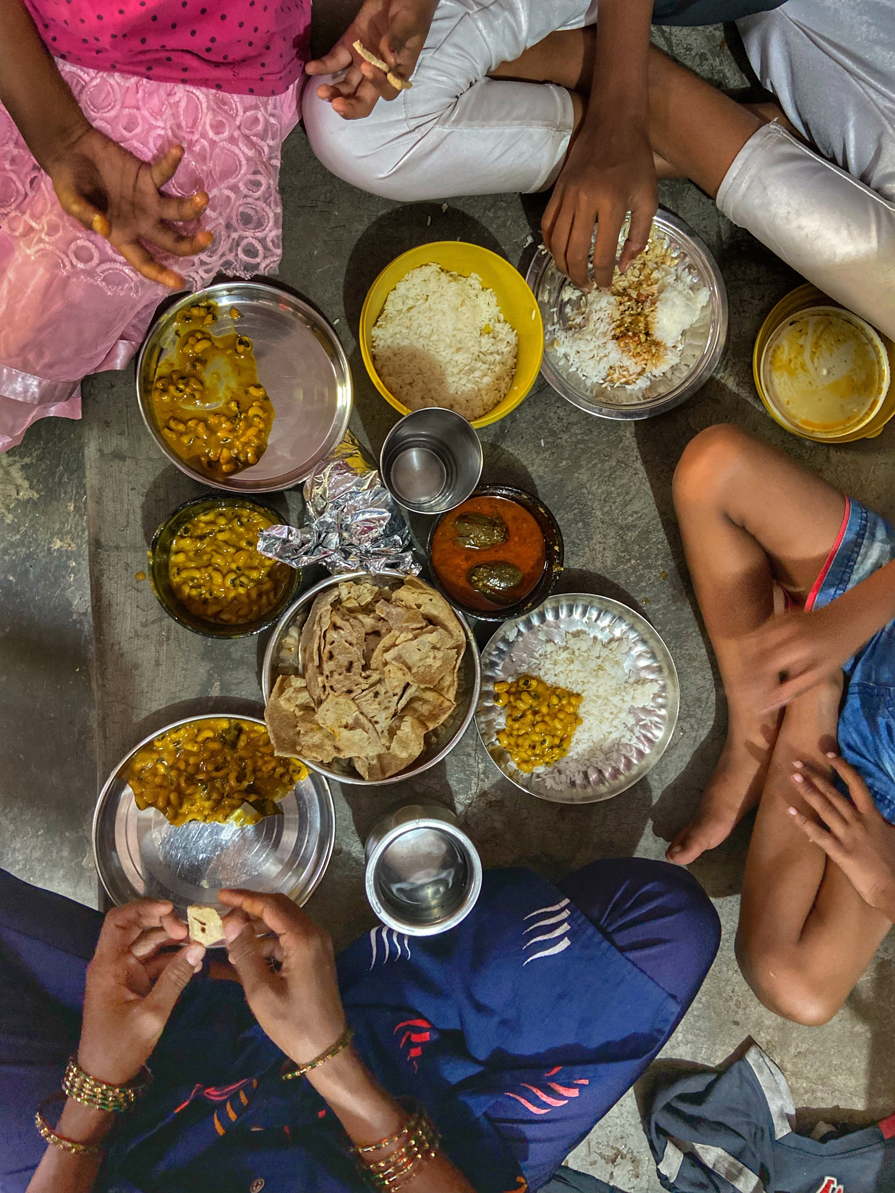 A meal at the Sonawane family home includes dry flatbreads, beans and handouts from an employer