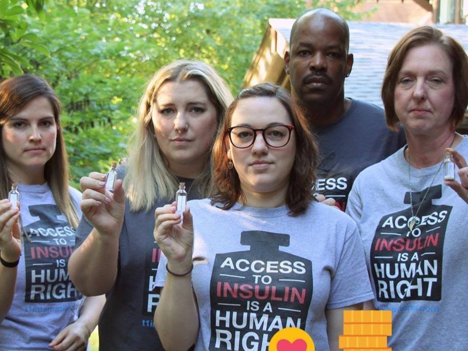 T1International activists including Nicole Smith-Holt, right, pose at an event)