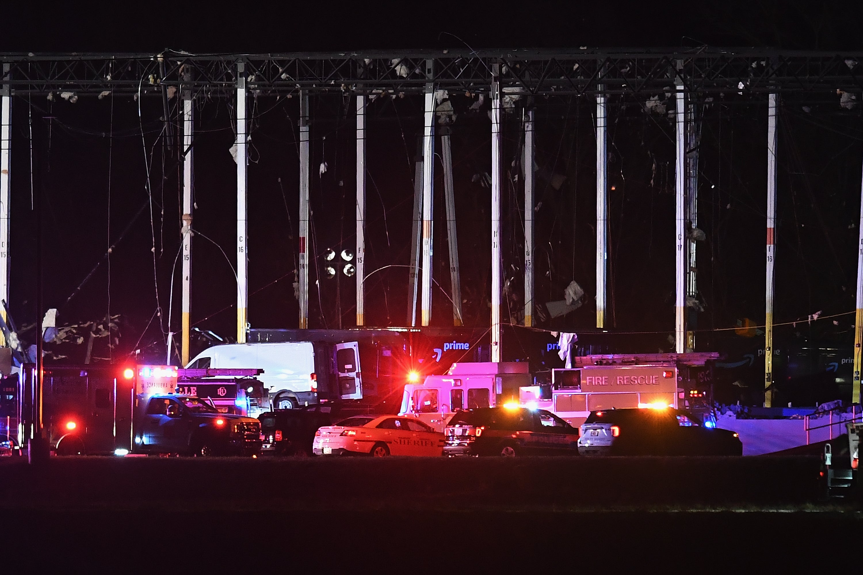 First responders surround a damaged Amazon Distribution Center on 10 December 2021 in Edwardsville, Illinois