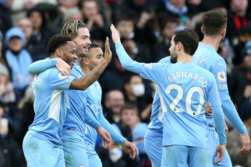 Raheem Sterling (left) is congratulated for scoring the only goal