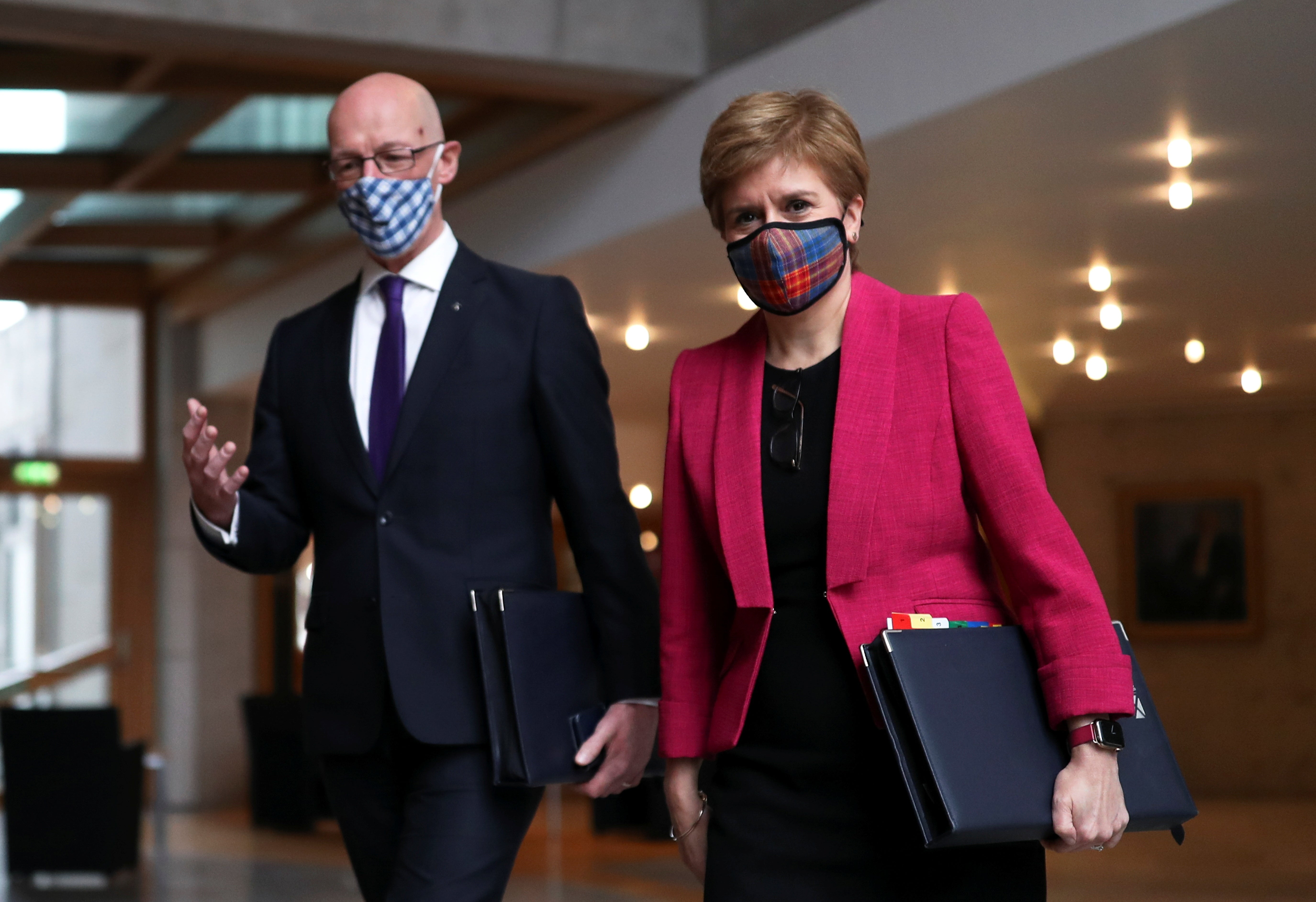 John Swinney (left, with Nicola Sturgeon) said the Scottish Government are considering new measure (Russell Cheyne/PA)