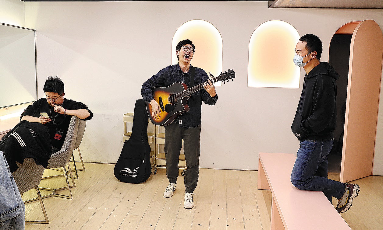 Stand-up comedians take a break backstage during a show in Beijing earlier this year