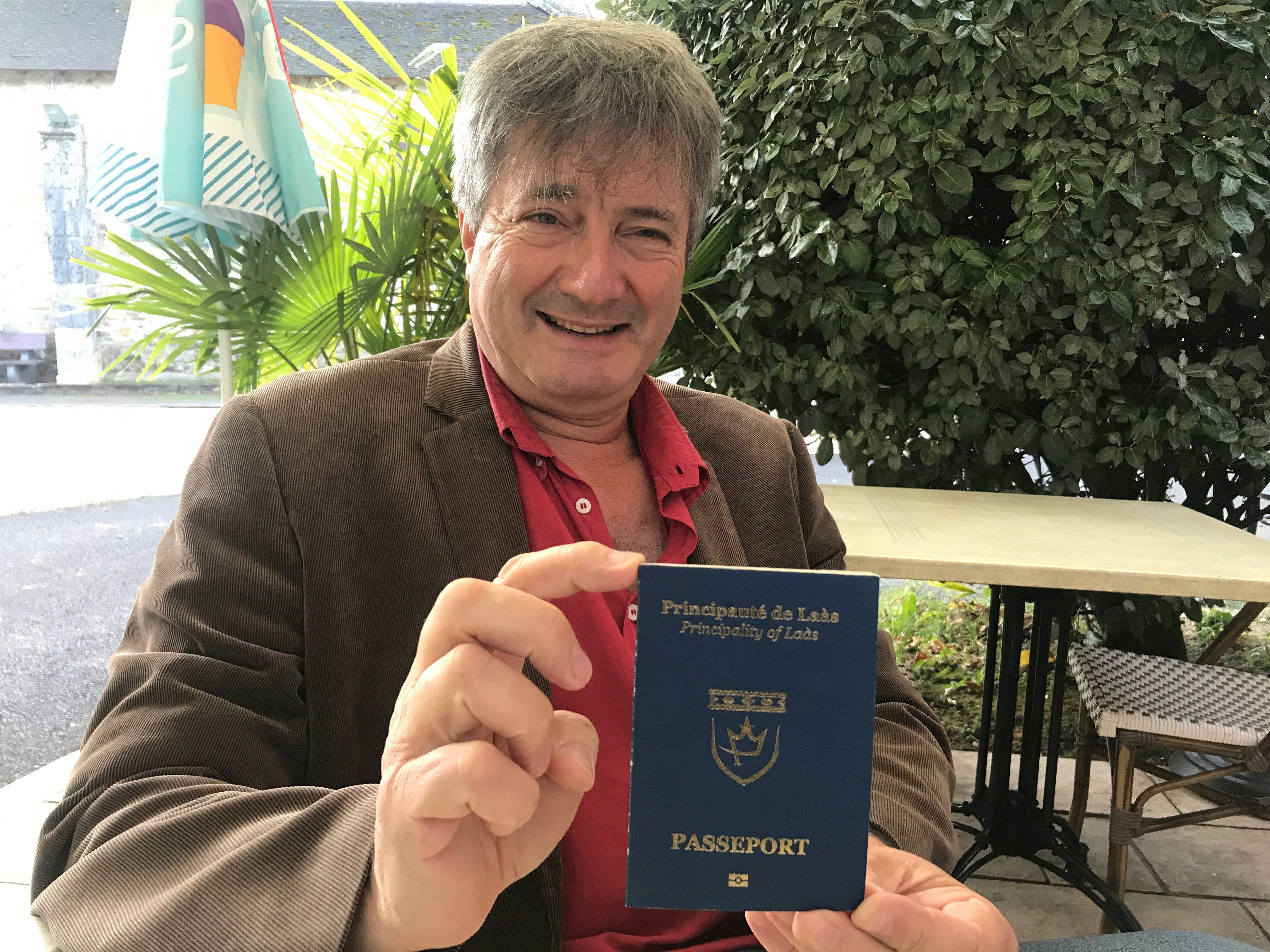 Mr Pedehontaa shows off the Laas passport he designed