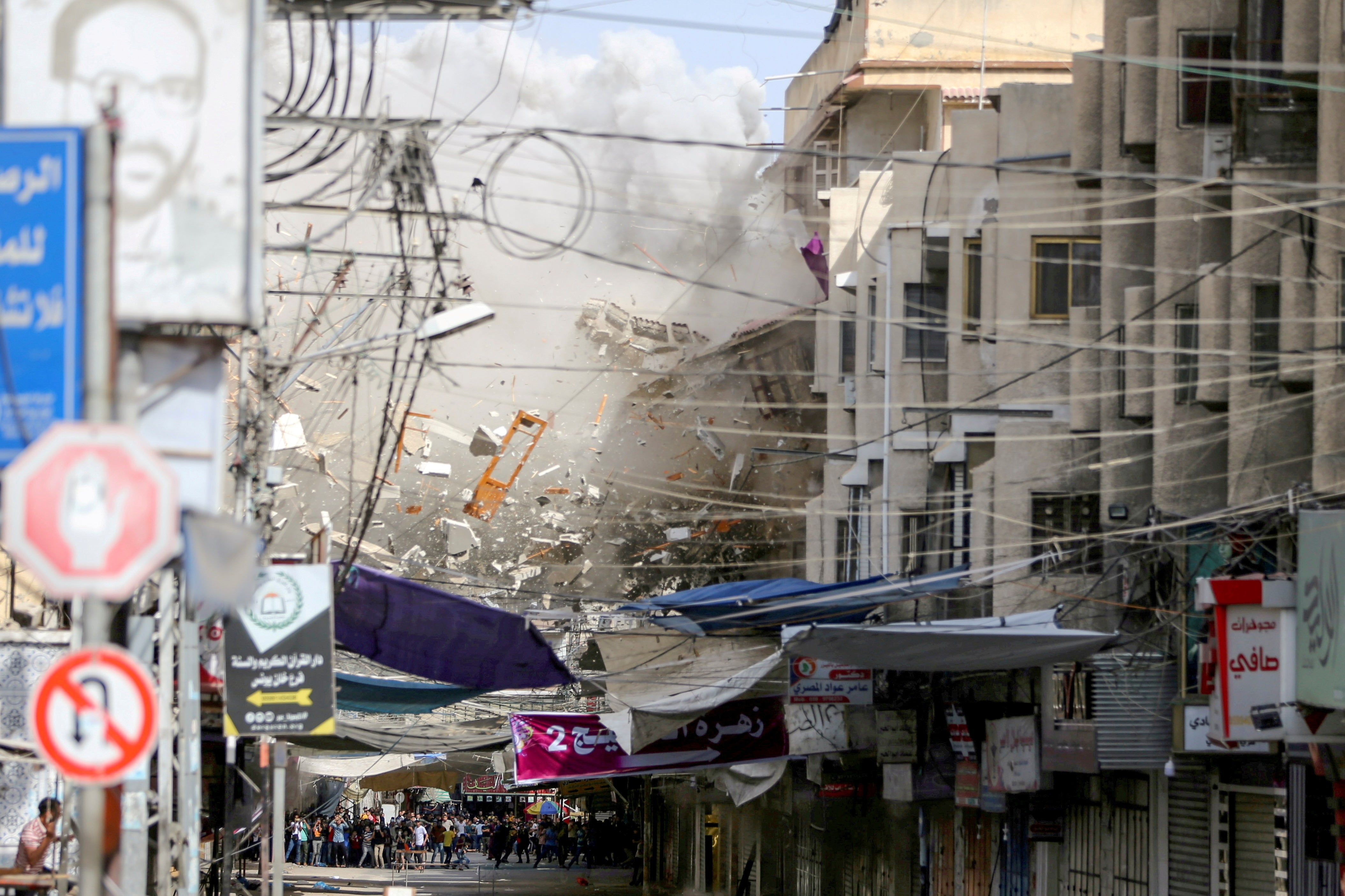 Debris flies following an Israeli air strike, amid Israeli-Palestinian fighting, in the Gaza Strip