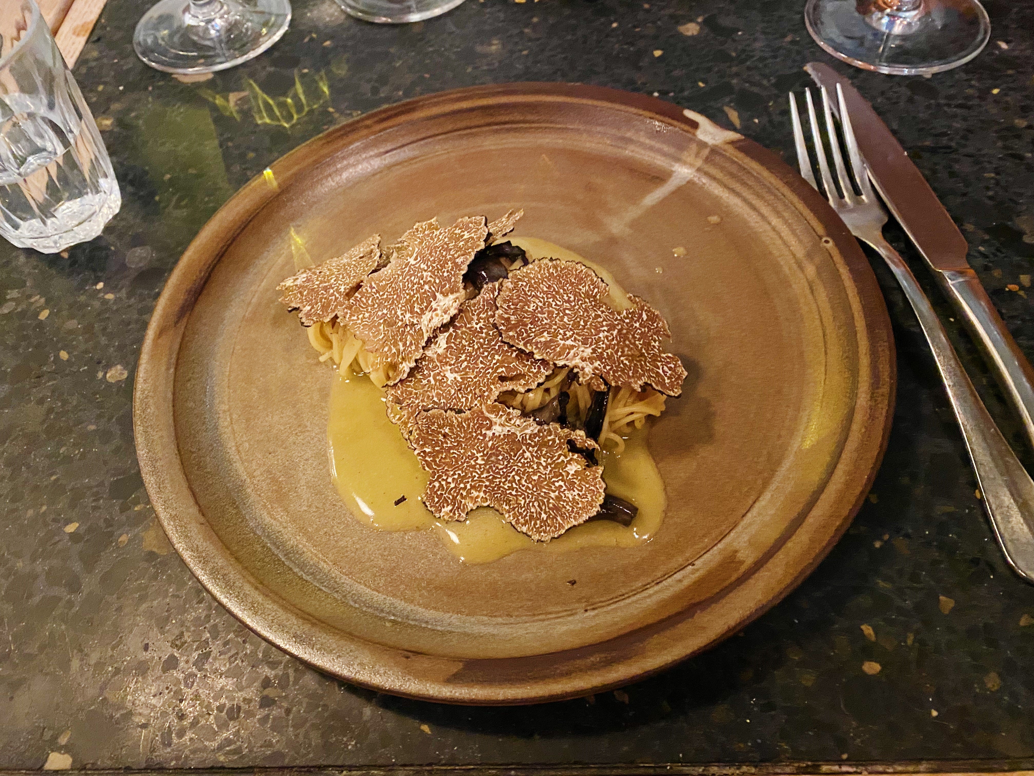 Tagliolini covered in a blanket of black truffle