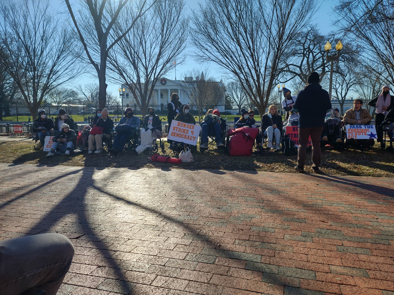 Student activists rally outside the White House on day 8 of a hunger strike for action on legislation to protect voting rights and reform election laws