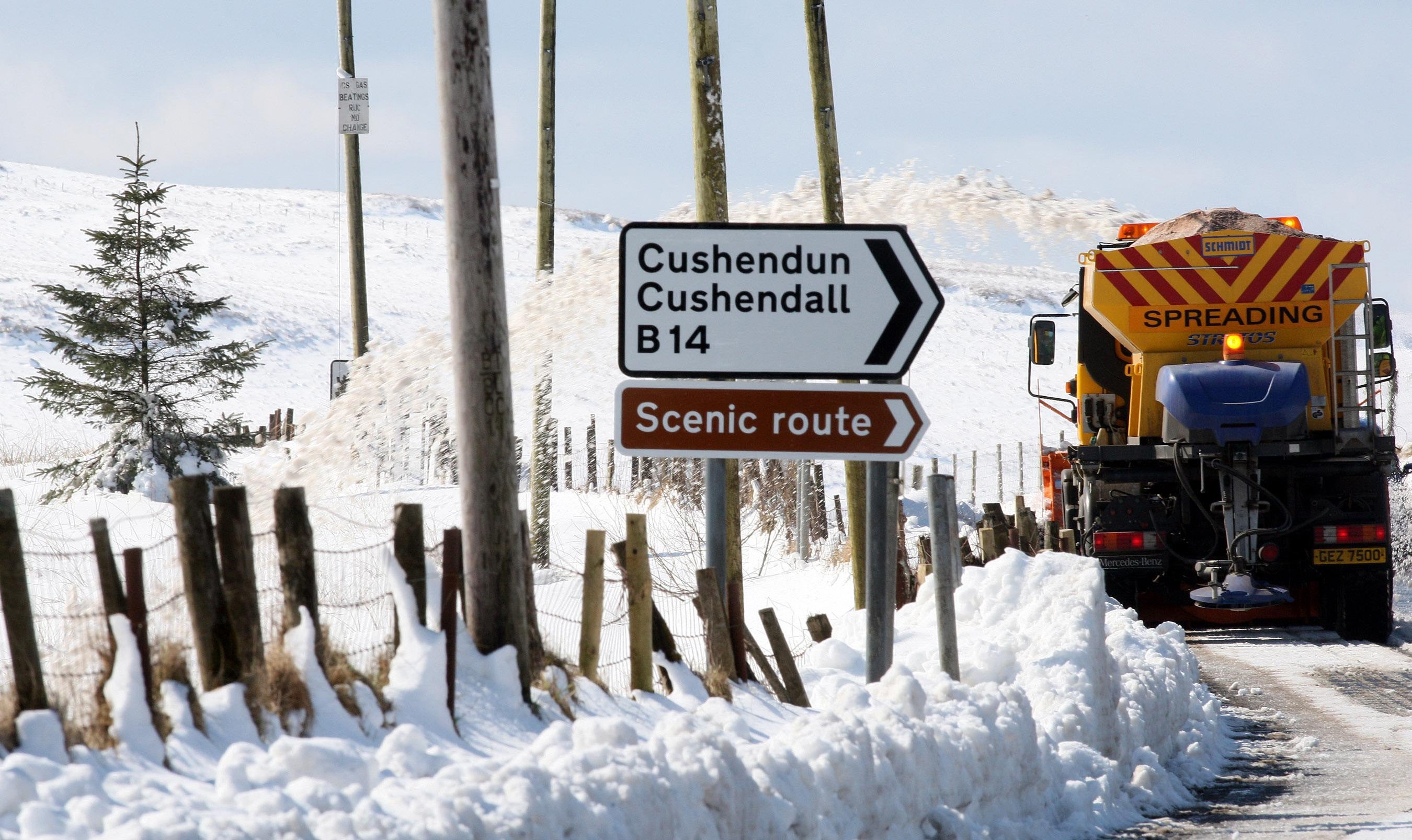 Gritters make their way down rural roads in the hills above Cushendall in Co Antrim (Paul Faith/PA)