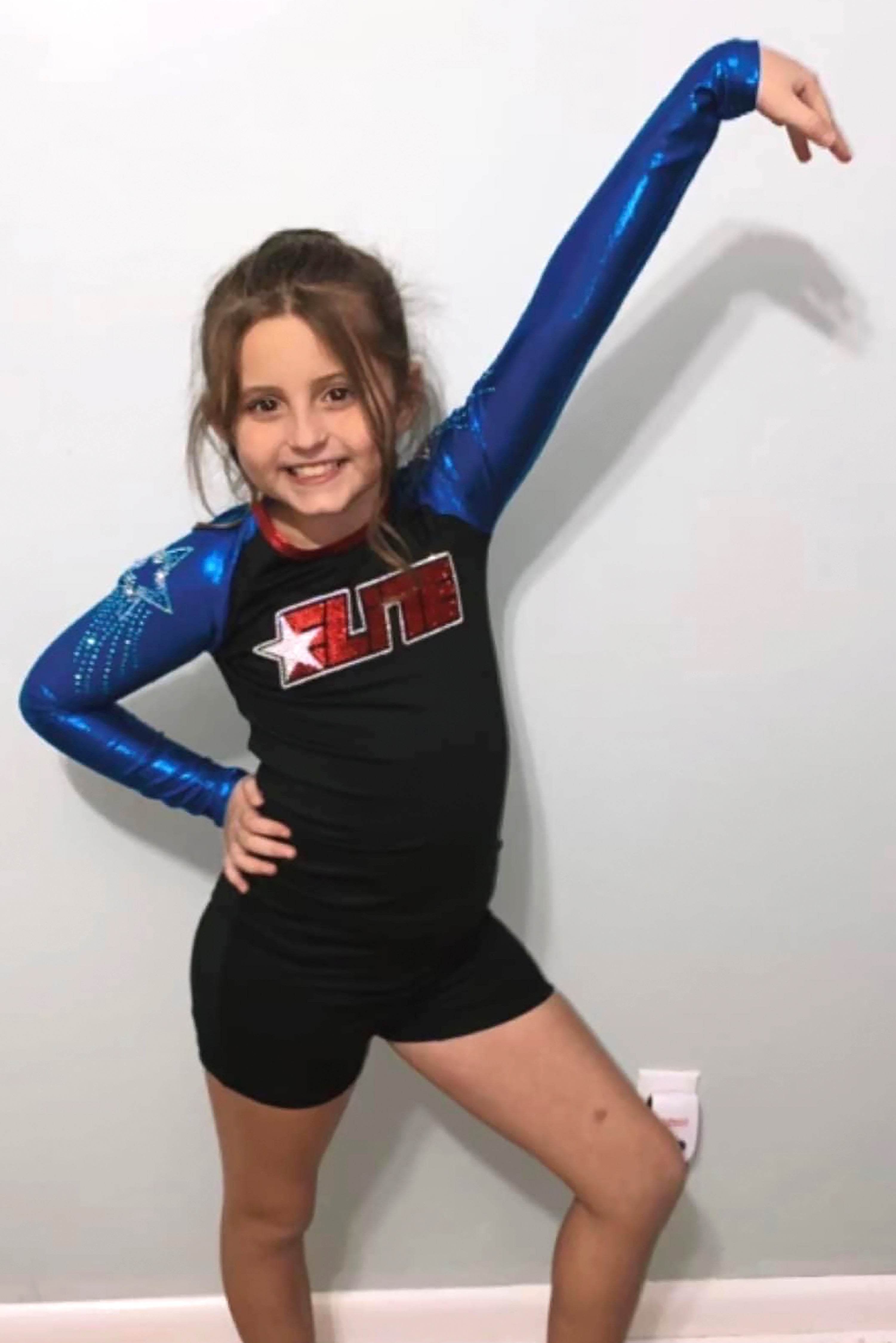 In this undated photo provided by Sandra Hooker, Annistyn Rackley, 9, poses for a picture while attending a cheerleading competition in Arizona