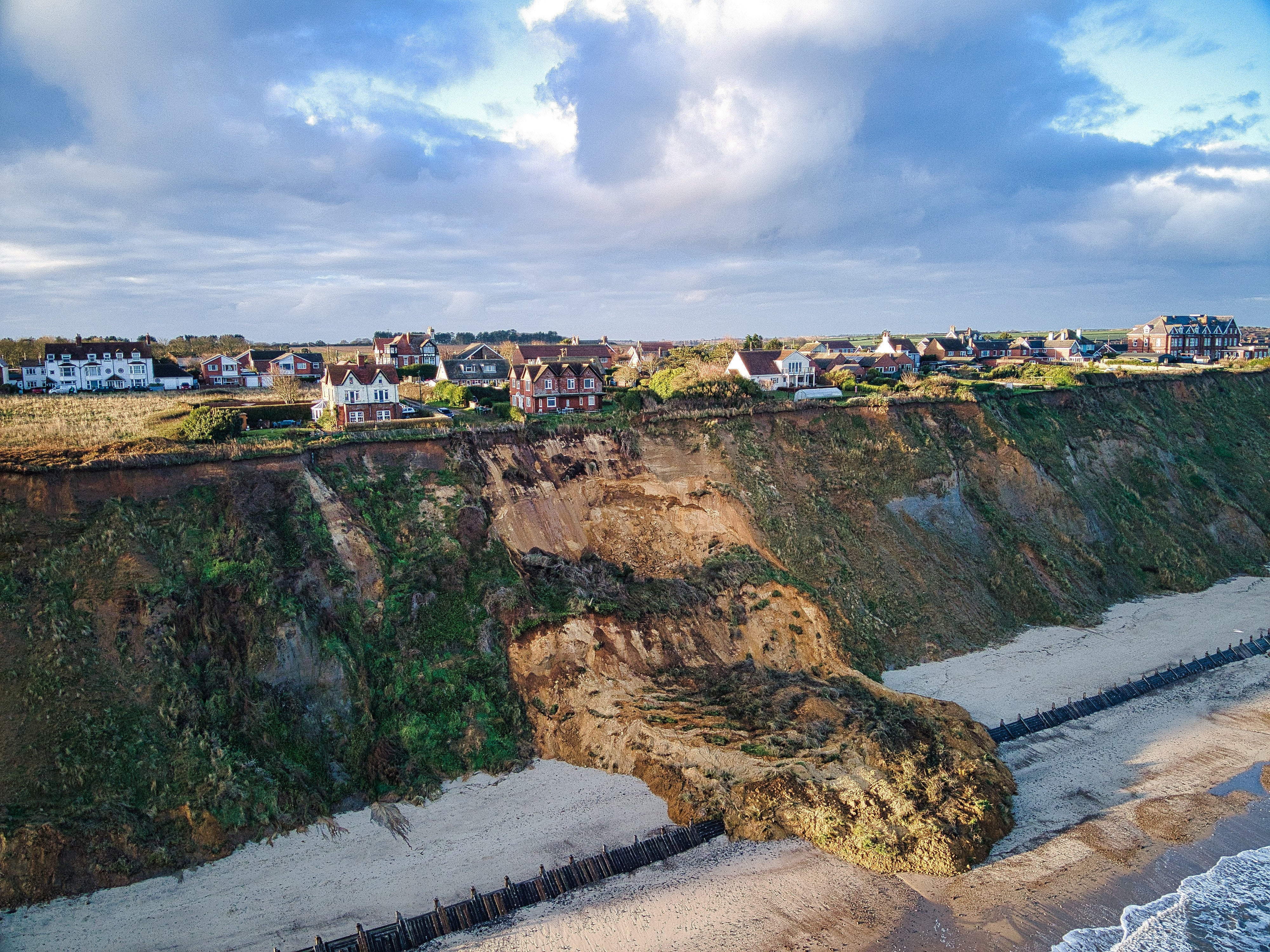 This is the shocking scene as two stunning cliff-top homes were left perching 40 mts above the sea after a huge landslide struck overnight