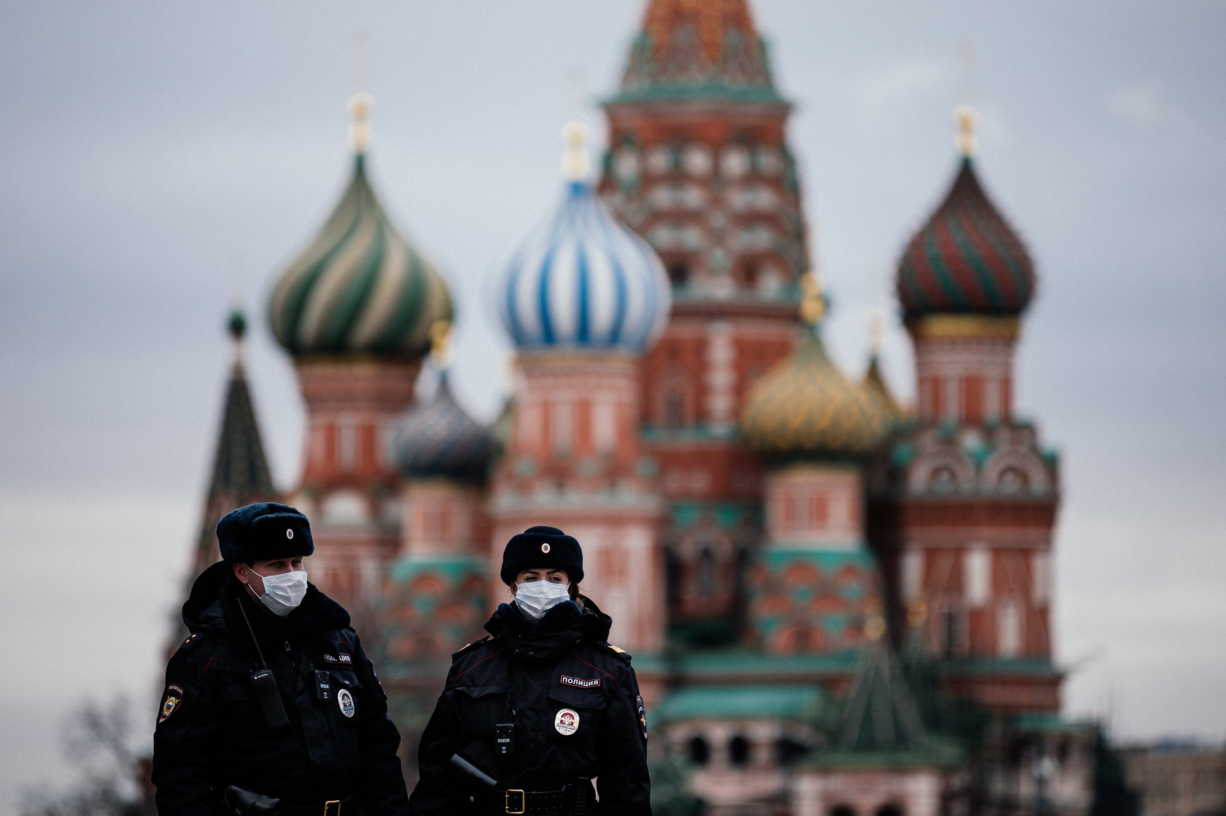 Russian police officers patrol Red Square in front of St Basil’s Cathedral in Moscow