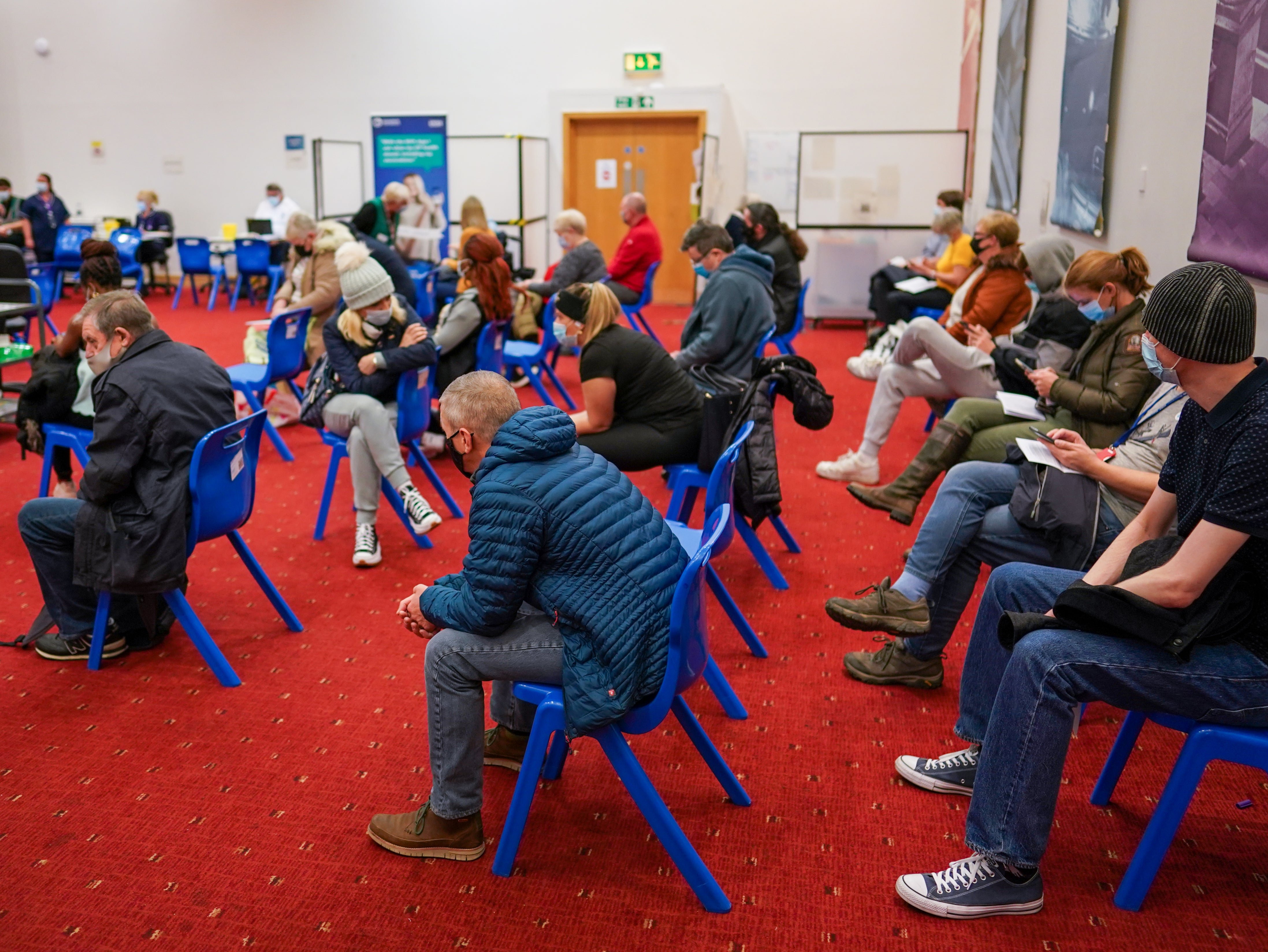 Patients wait to receive their booster jabs in Newcastle upon Tyne