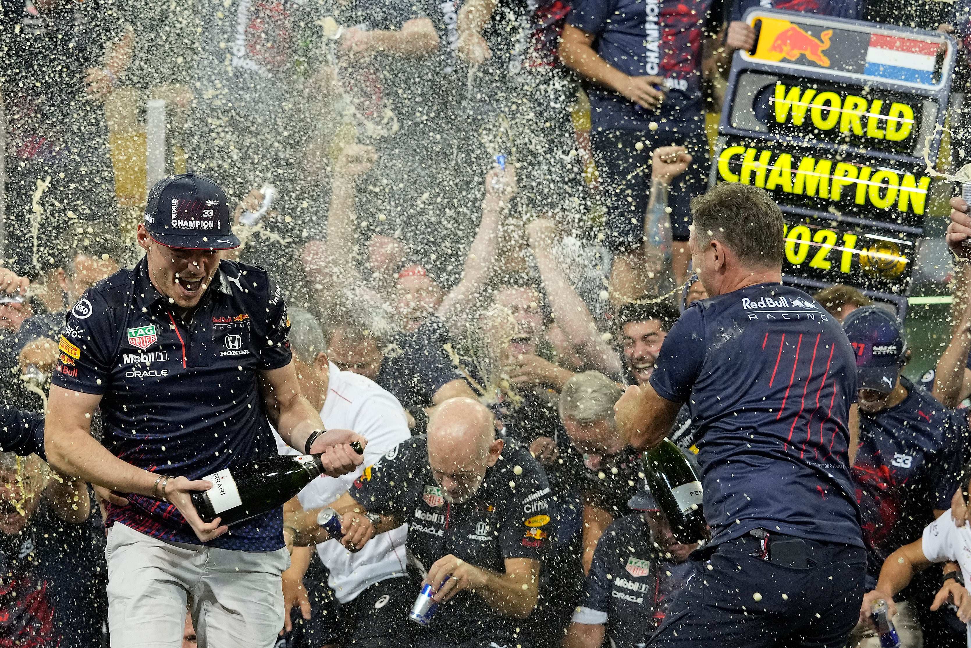 Max Verstappen celebrated with his Red Bull team after winning his first F1 title (Hassan Ammar/AP)