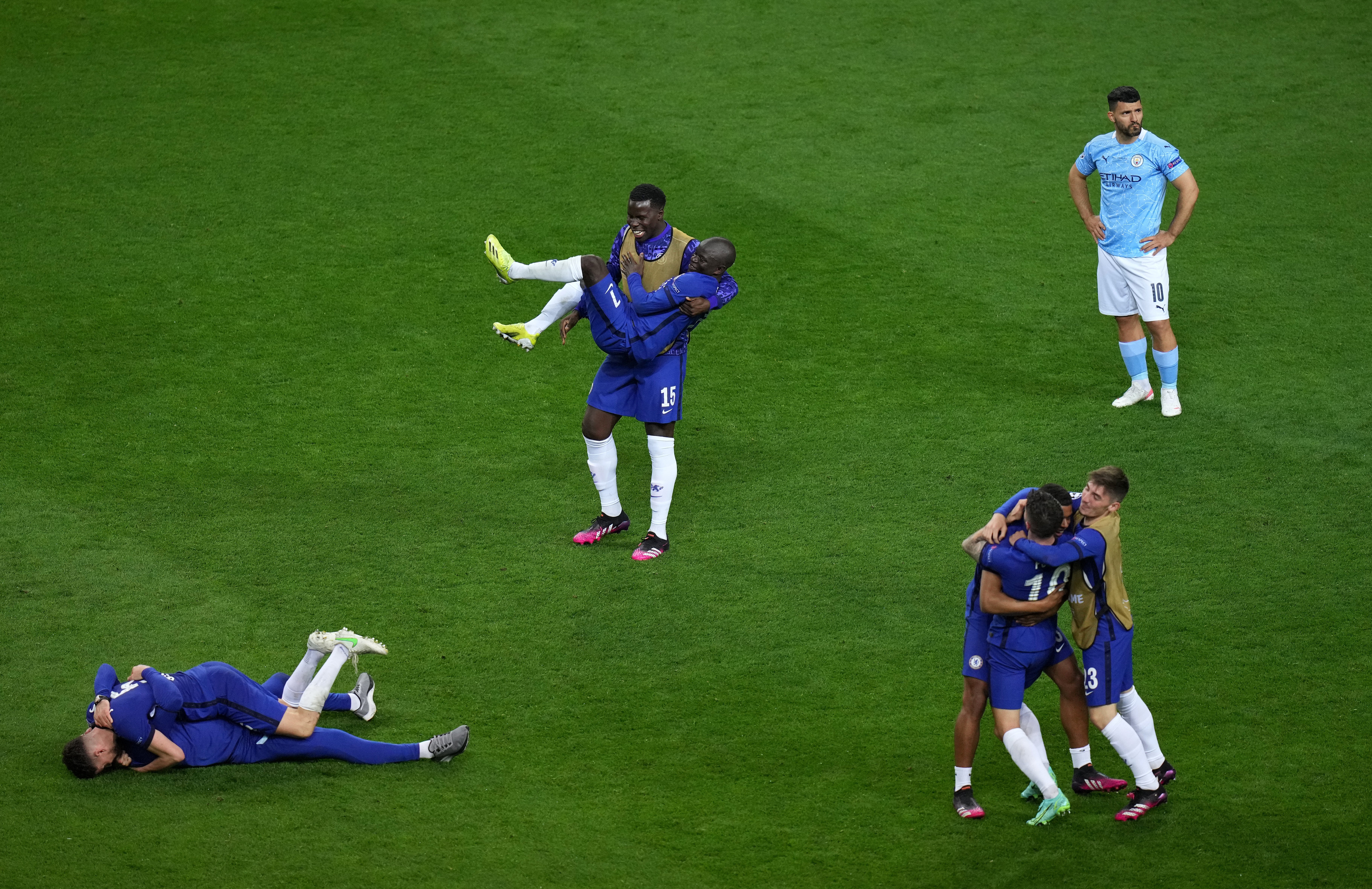 Chelsea players celebrate after beating Manchester City in the Champions League final in Porto as City’s Sergio Aguero (right) appears dejected (Adam Davy/PA)