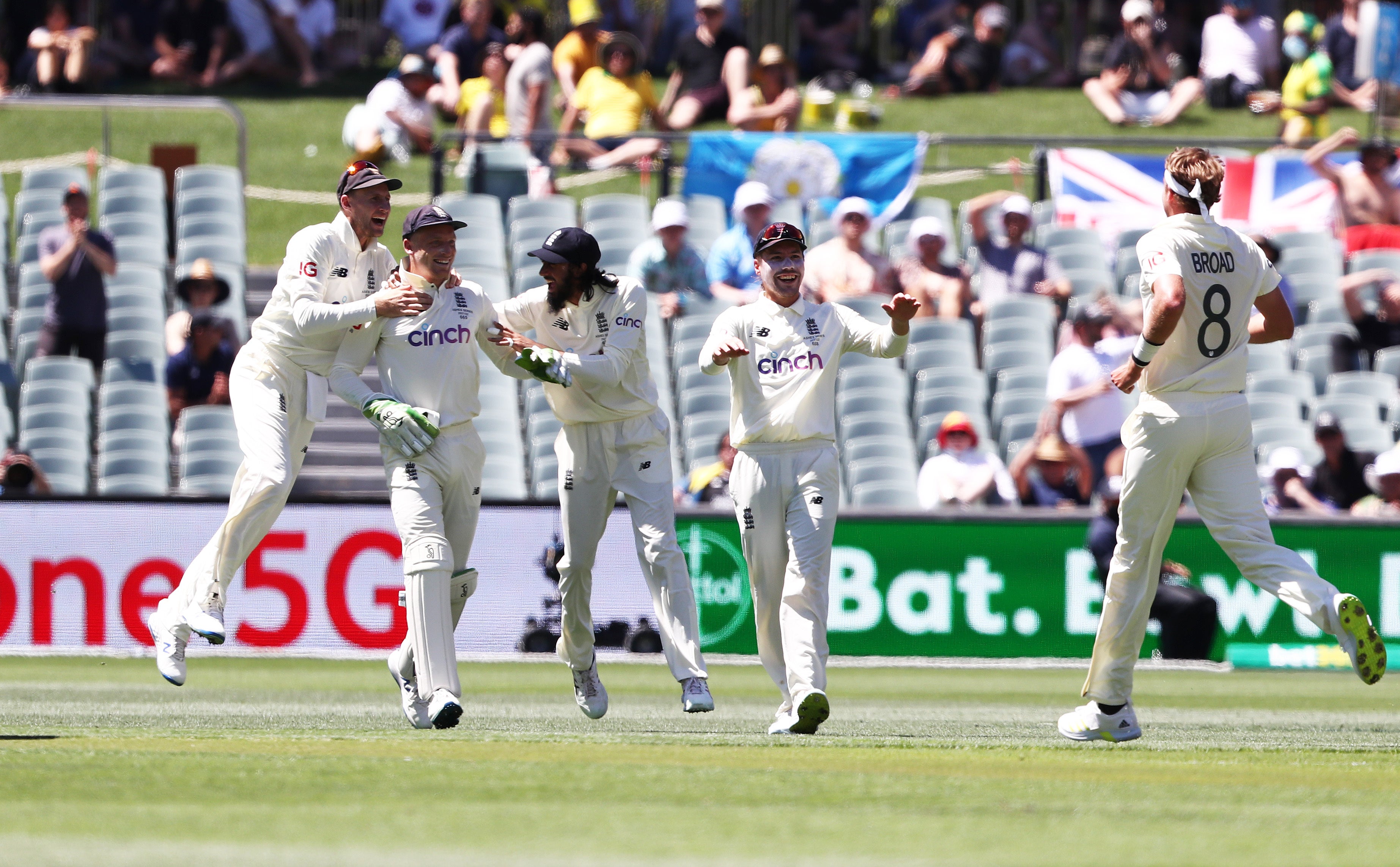 England players celebrate after Jos Buttler caught out Marcus Harris (Jason O’Brien/PA)