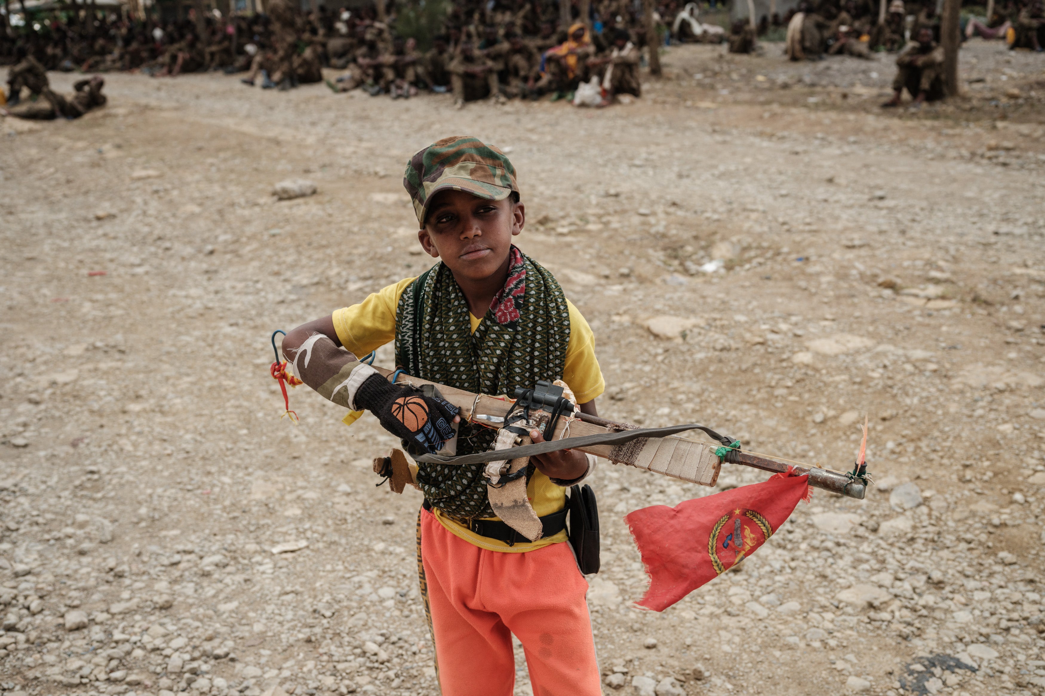 An 11-year-old Tigrayan soldier holds a handmade rifle