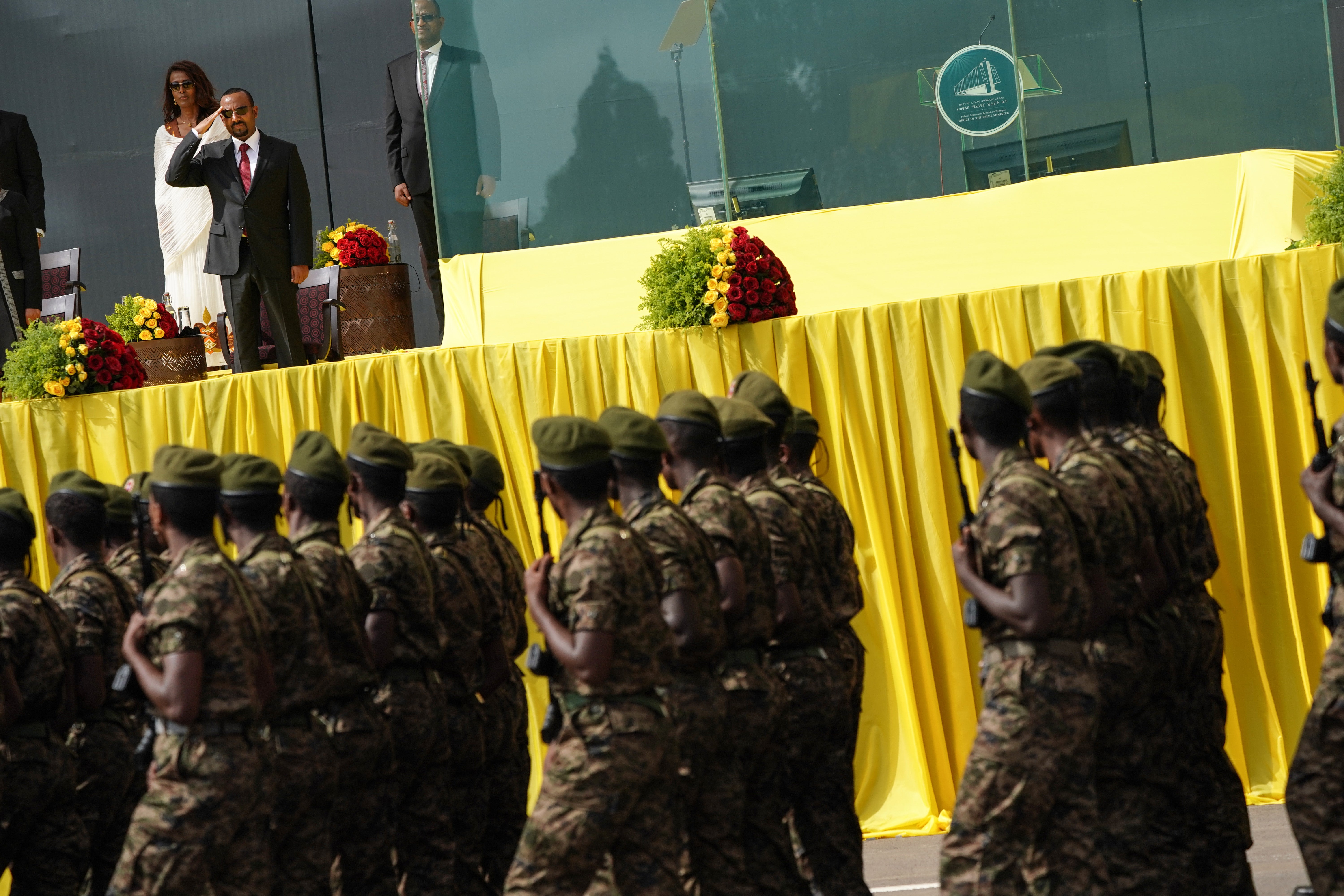 Ahmed salutes soldiers after being sworn in for a second five-year term in October 2021