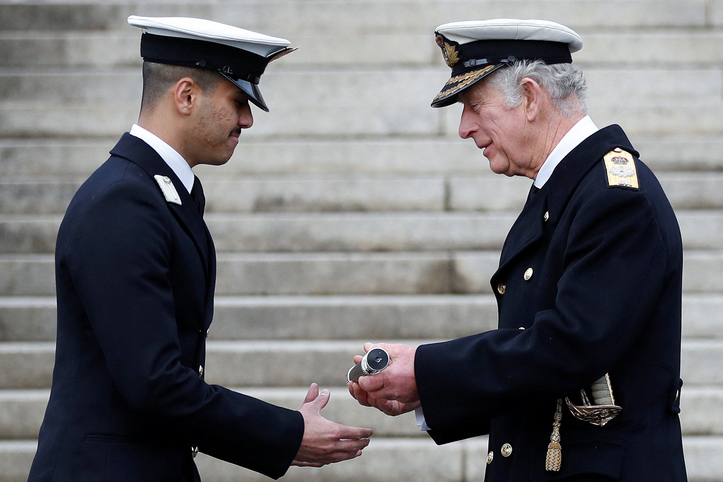 The Prince of Wales, Admiral of the Fleet, presents the Admiralty Prize to Midshipman Yazeen Al Bidah of the Saudi Arabian Navy (Peter Nicholls/PA)