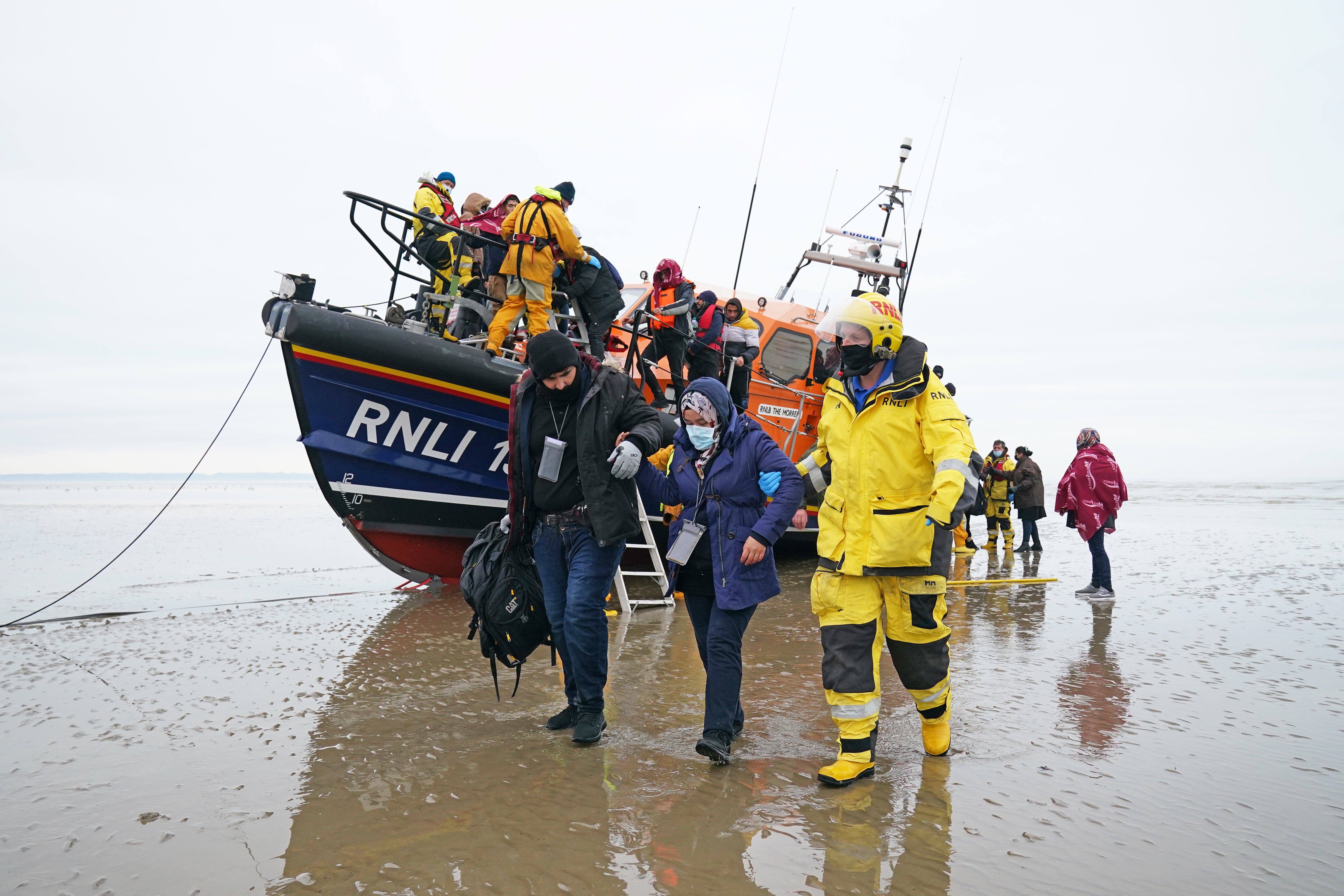 A group of people thought to be migrants are brought in to Dungeness, Kent, by the RNLI (Gareth Fuller/PA)