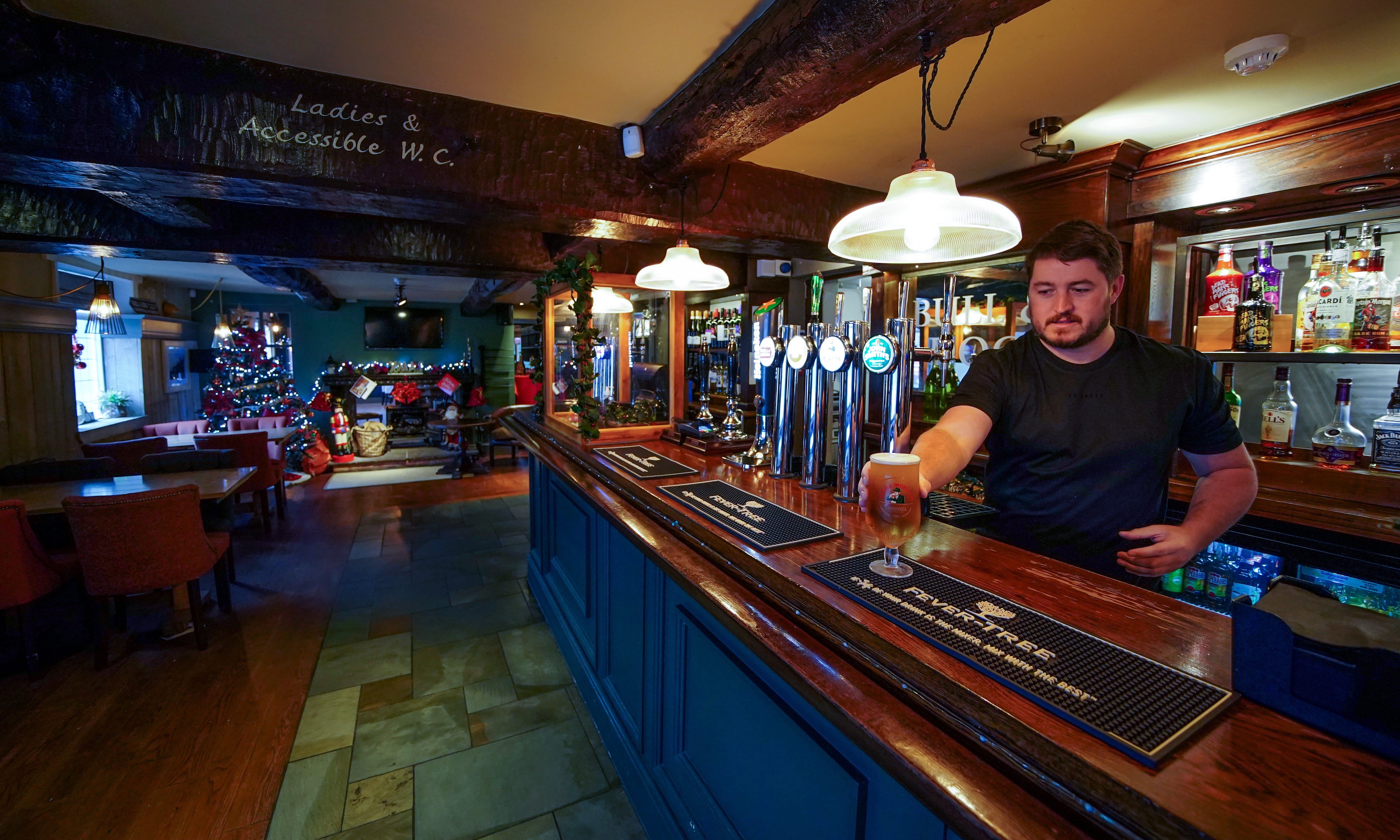 Keith McGimpsey, landlord at the Bull and Dog pub and restaurant in Ormskirk, prepares to open after more bookings were cancelled. Hospitality firms are ramping up calls for support from the Government for hard-hit pubs and restaurants as the Omicron variant sweeps the country and consumer confidence is knocked by new restrictions and increasing health warnings. Picture date: Thursday December 16, 2021.