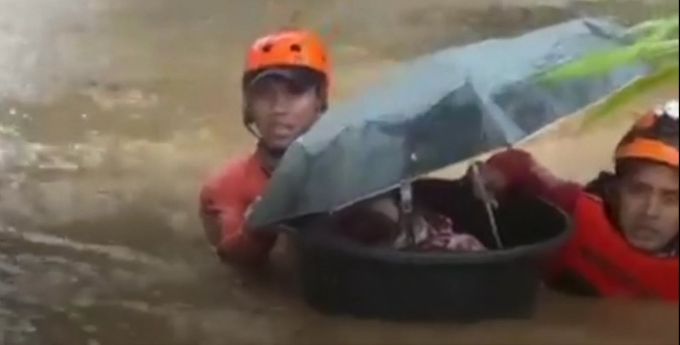 Philippines typhoon Rai: Month-old baby rescued to safety in a tub