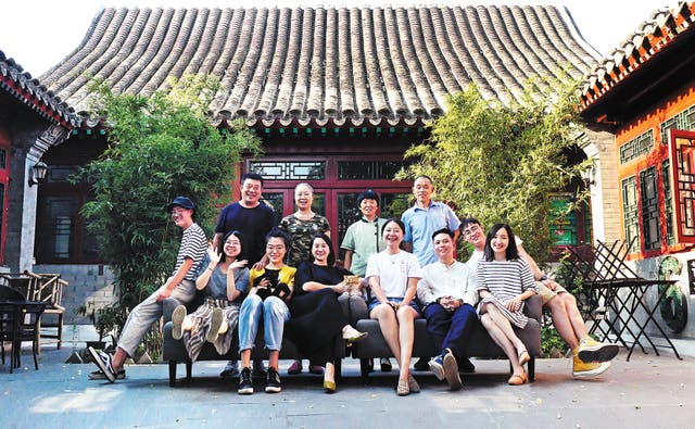 <p>A group photo of Niu Ruixue (fifth from left, front row) and the rest of the team from 27 Yard in Beijing</p>