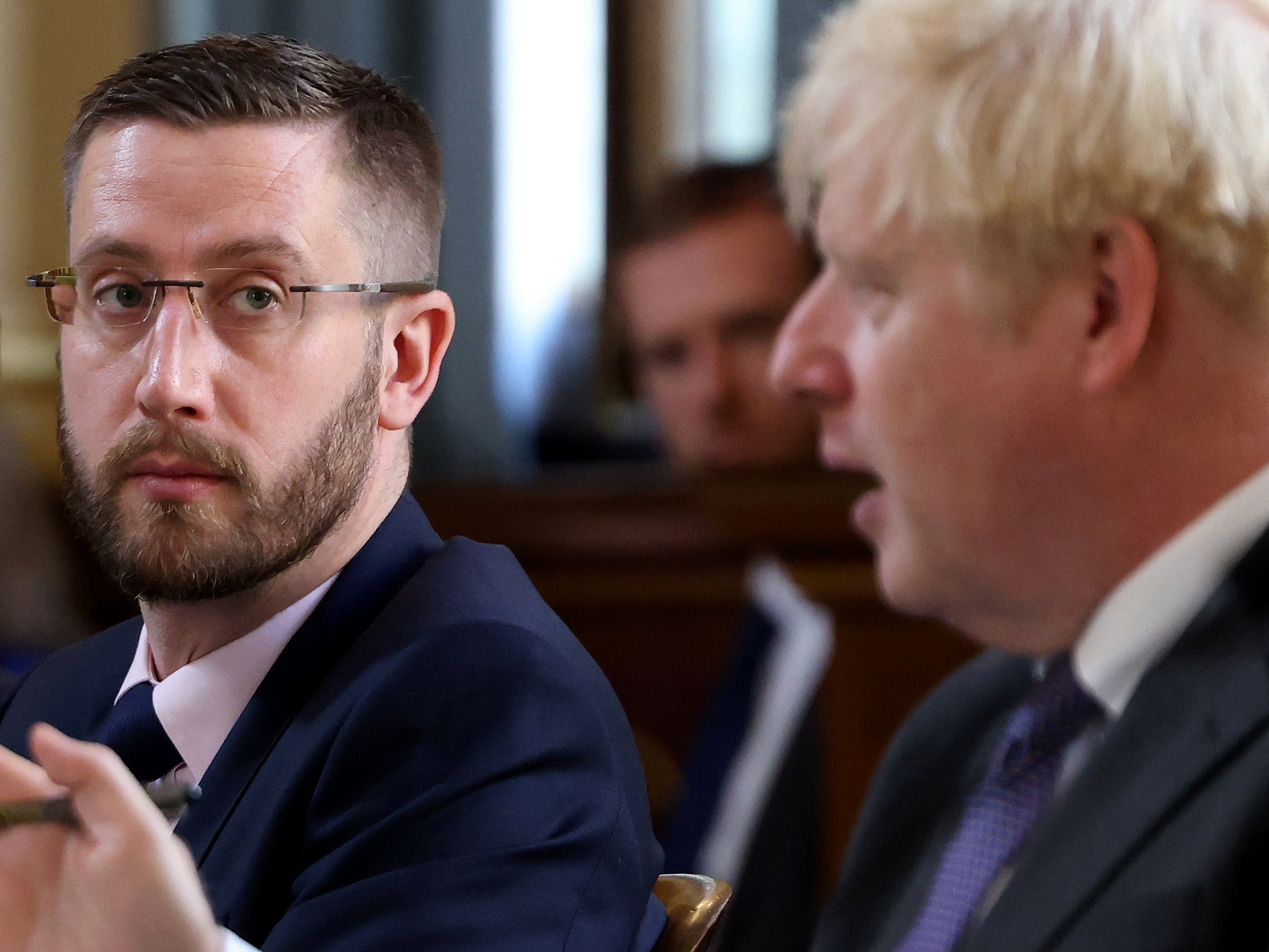 Boris Johnson pictured with Simon Case, who reportedly gave advice to the former PM to stop seeking financial advice from Richard Sharp