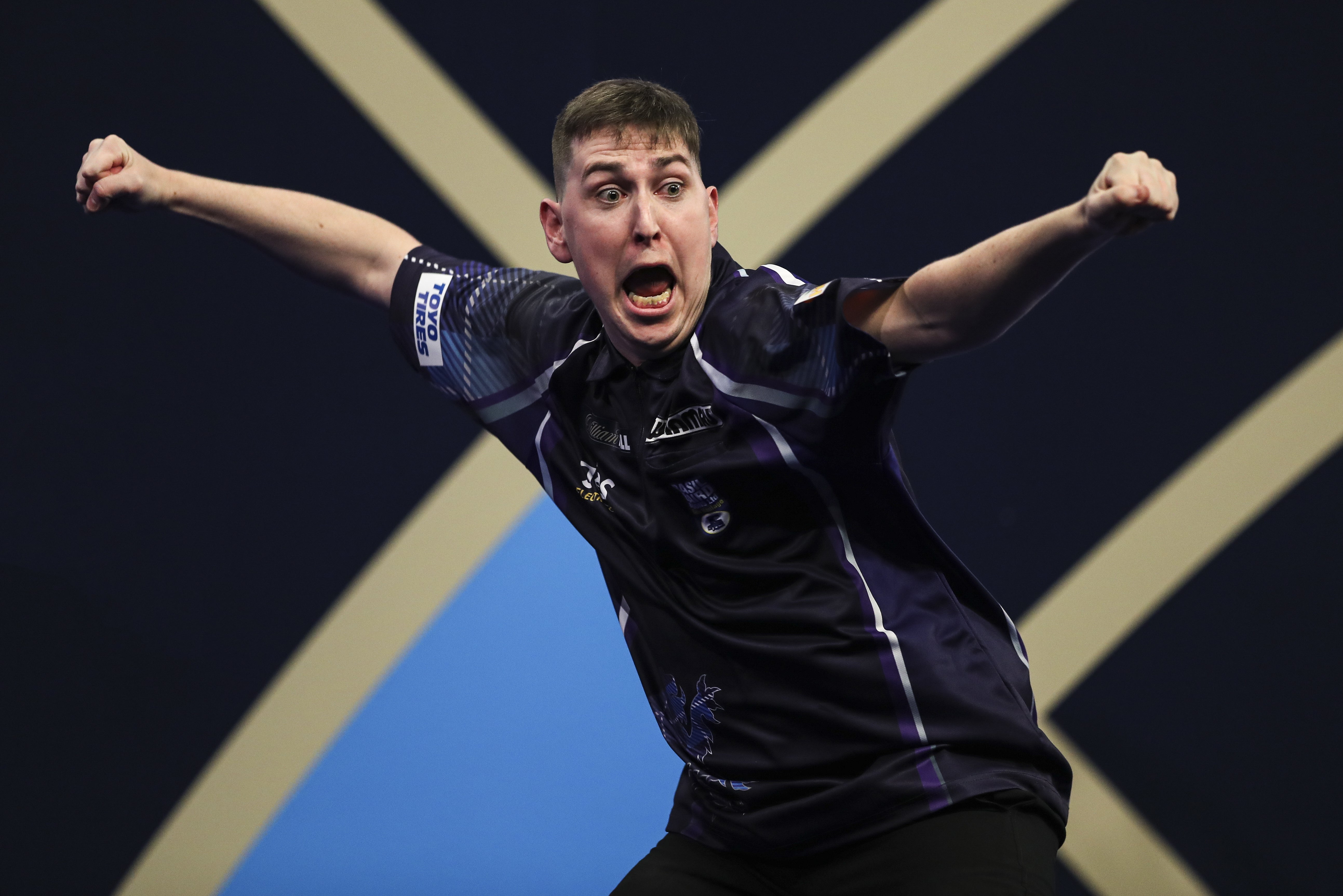 William Borland celebrates his historic nine-dart finish on his World Championship debut (Kieran Cleeves/PA)