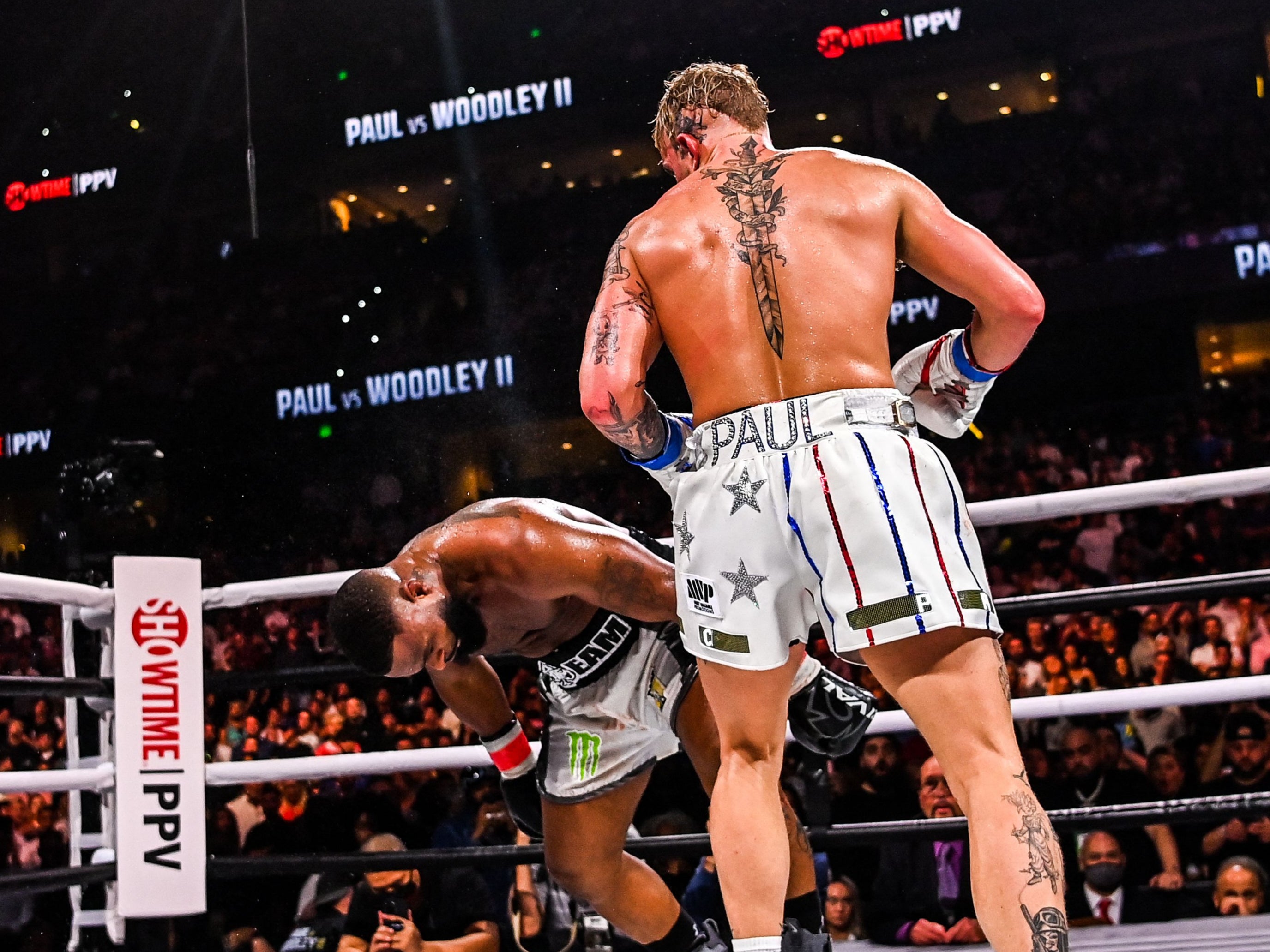 Jake Paul (right) knocked out Tyron Woodley in the sixth round