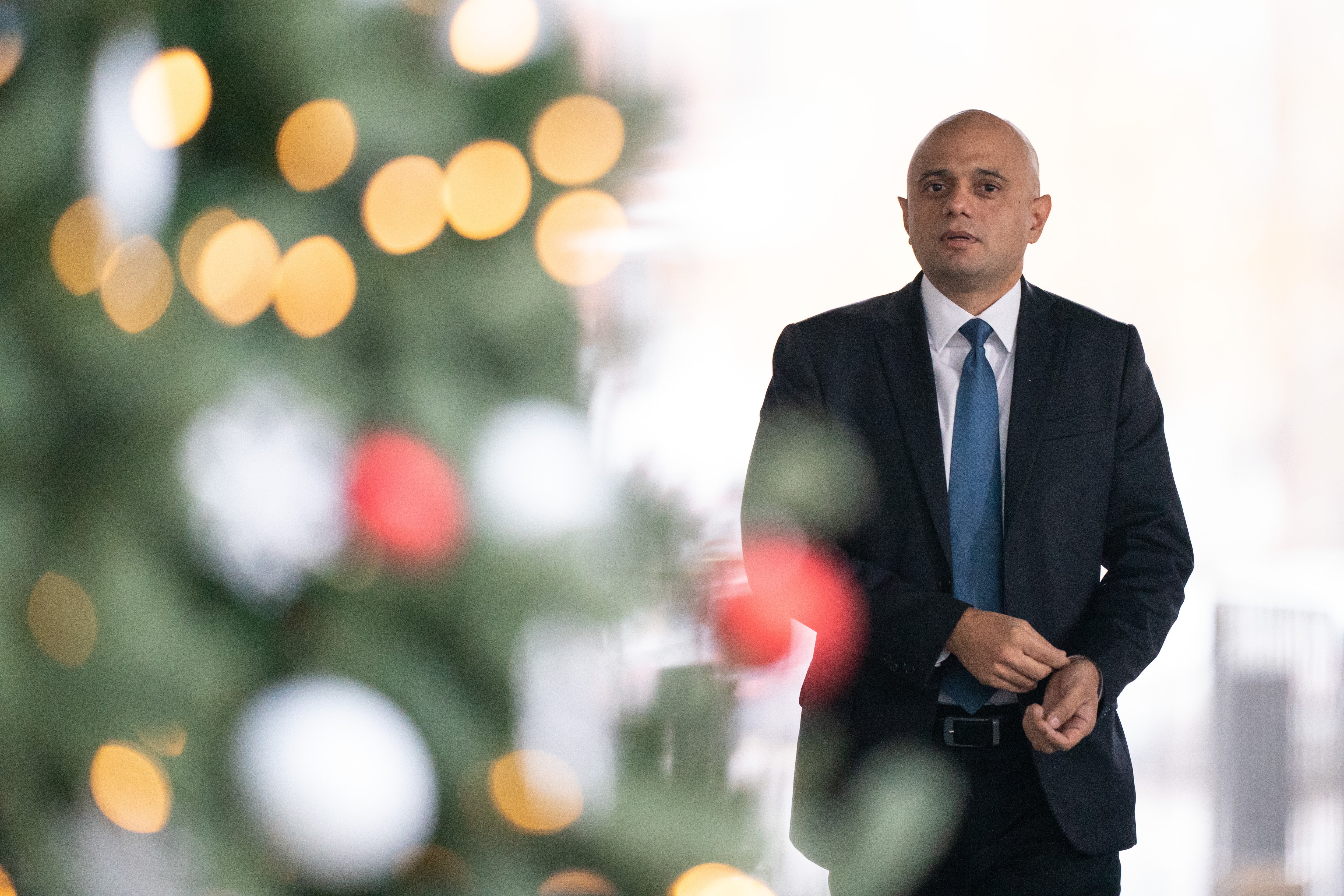 Health Secretary Sajid Javid said he would cut down on hugs from his mum at Christmas due to Omicron (Dominic Lipinski/PA)