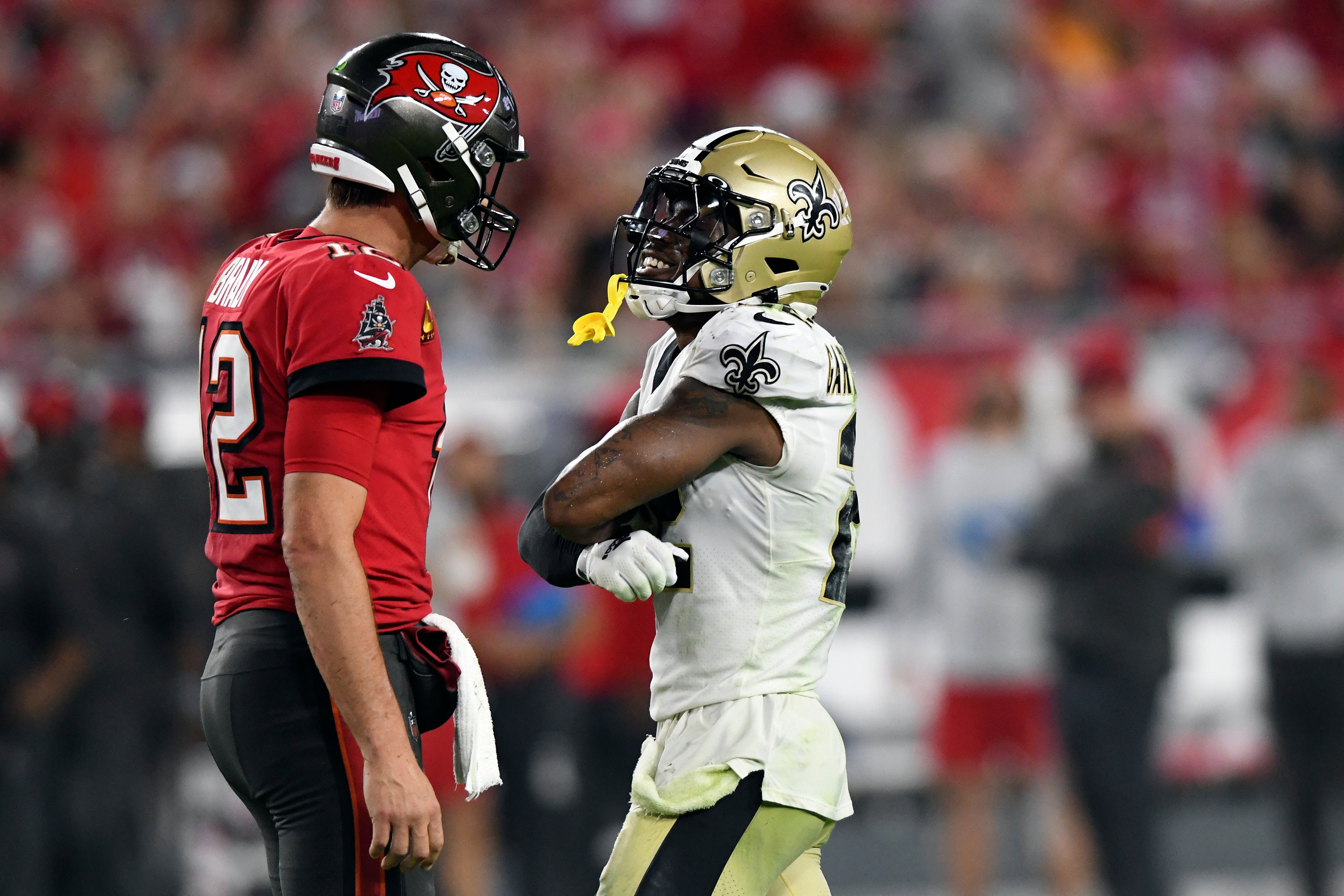 Chauncey Gardner-Johnson, right, smiles in the face of Tampa Bay Buccaneers quarterback Tom Brady (Jason Behnken/AP)